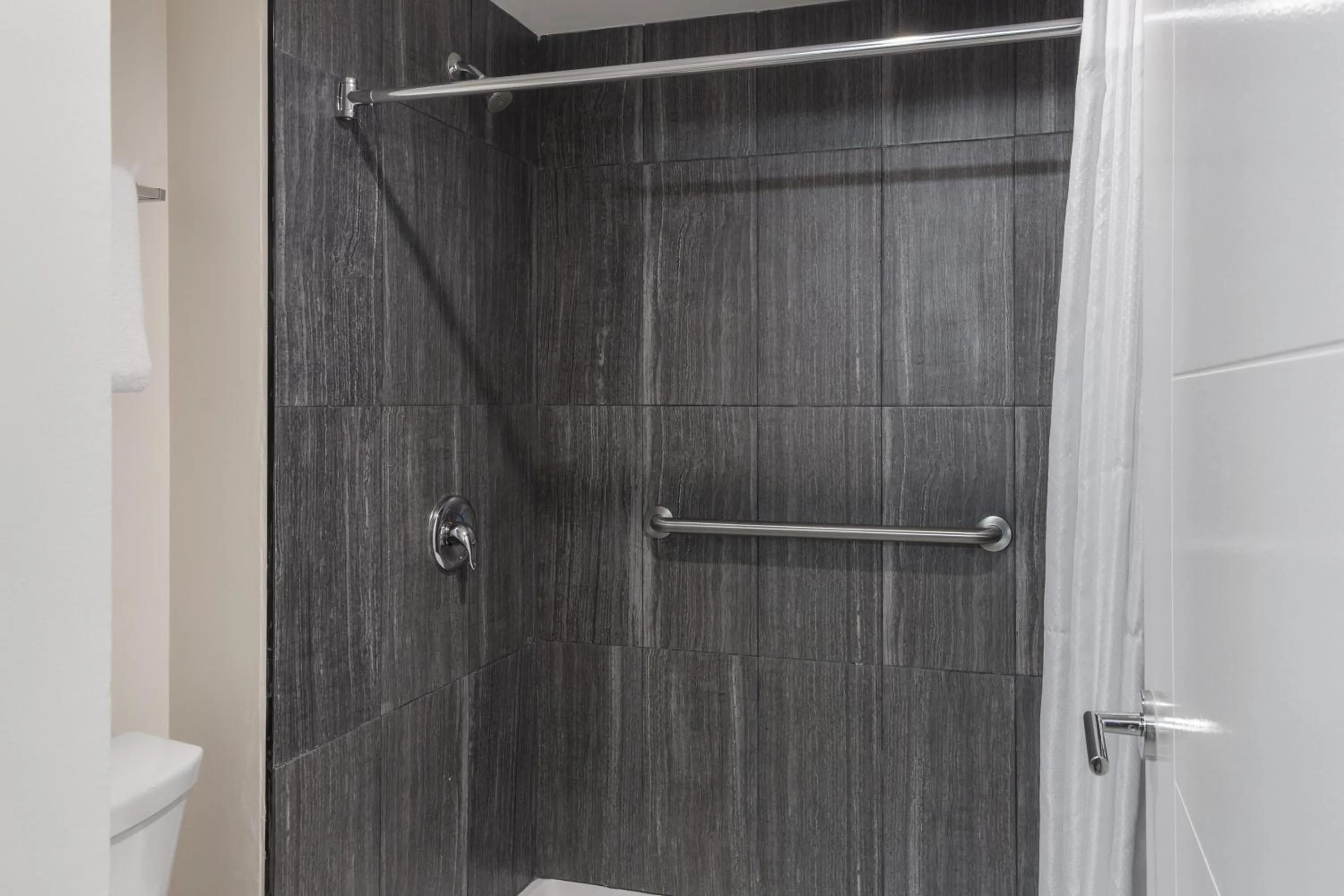 Bathroom in HOM Hotel Gainesville, SureStay Collection by Best Western