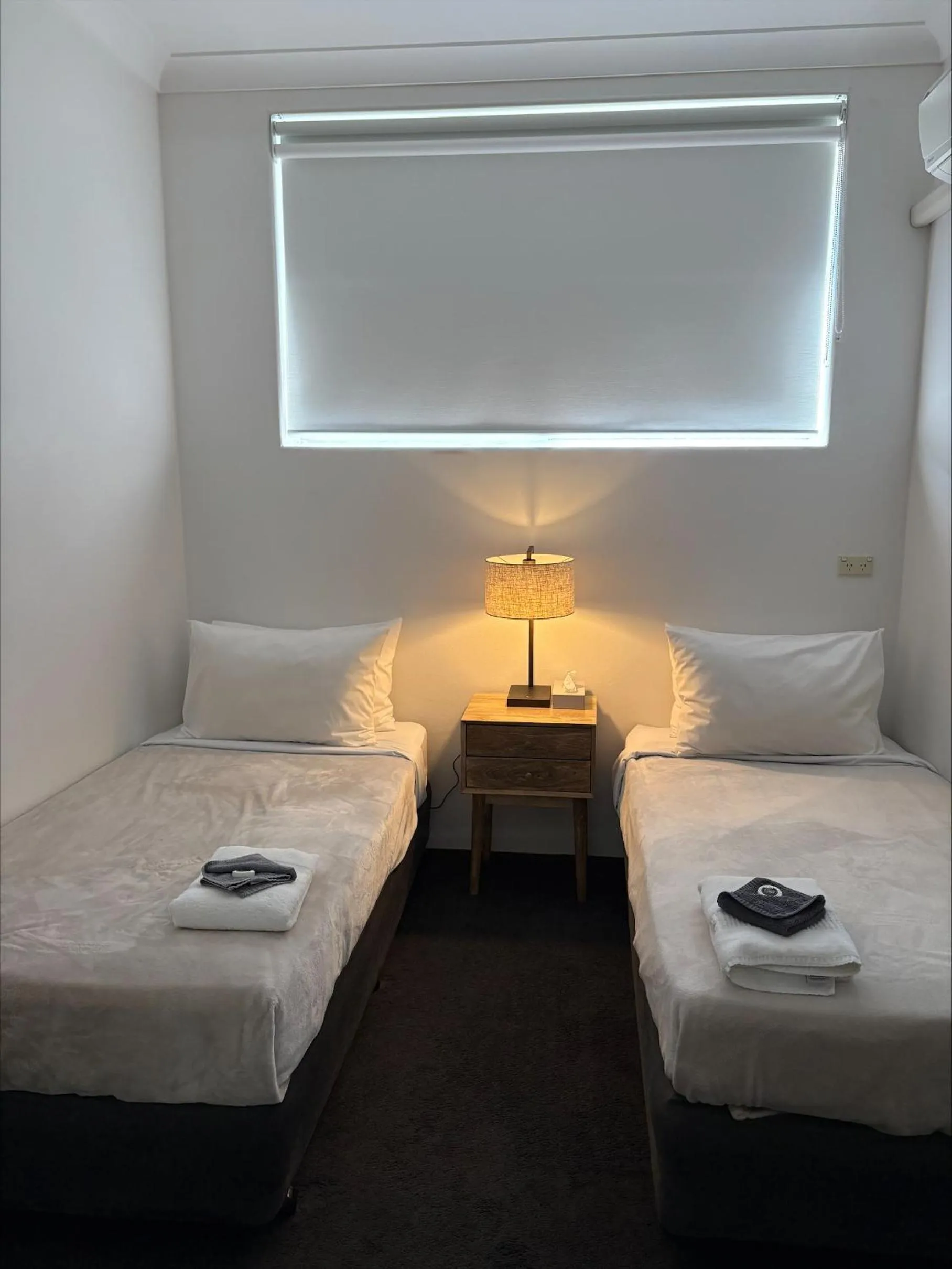 Bed in Tall Timbers Motel