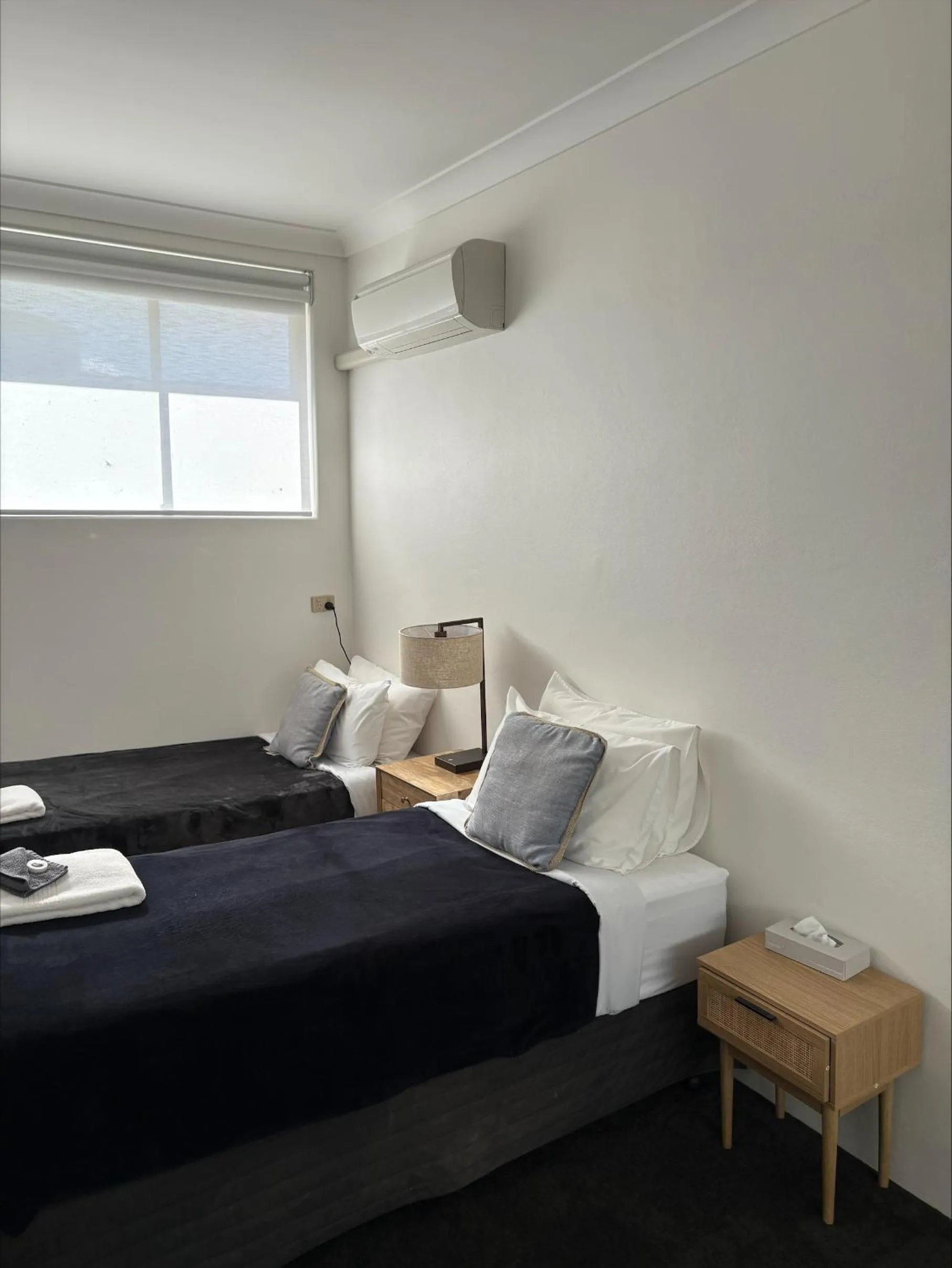 Bed in Tall Timbers Motel