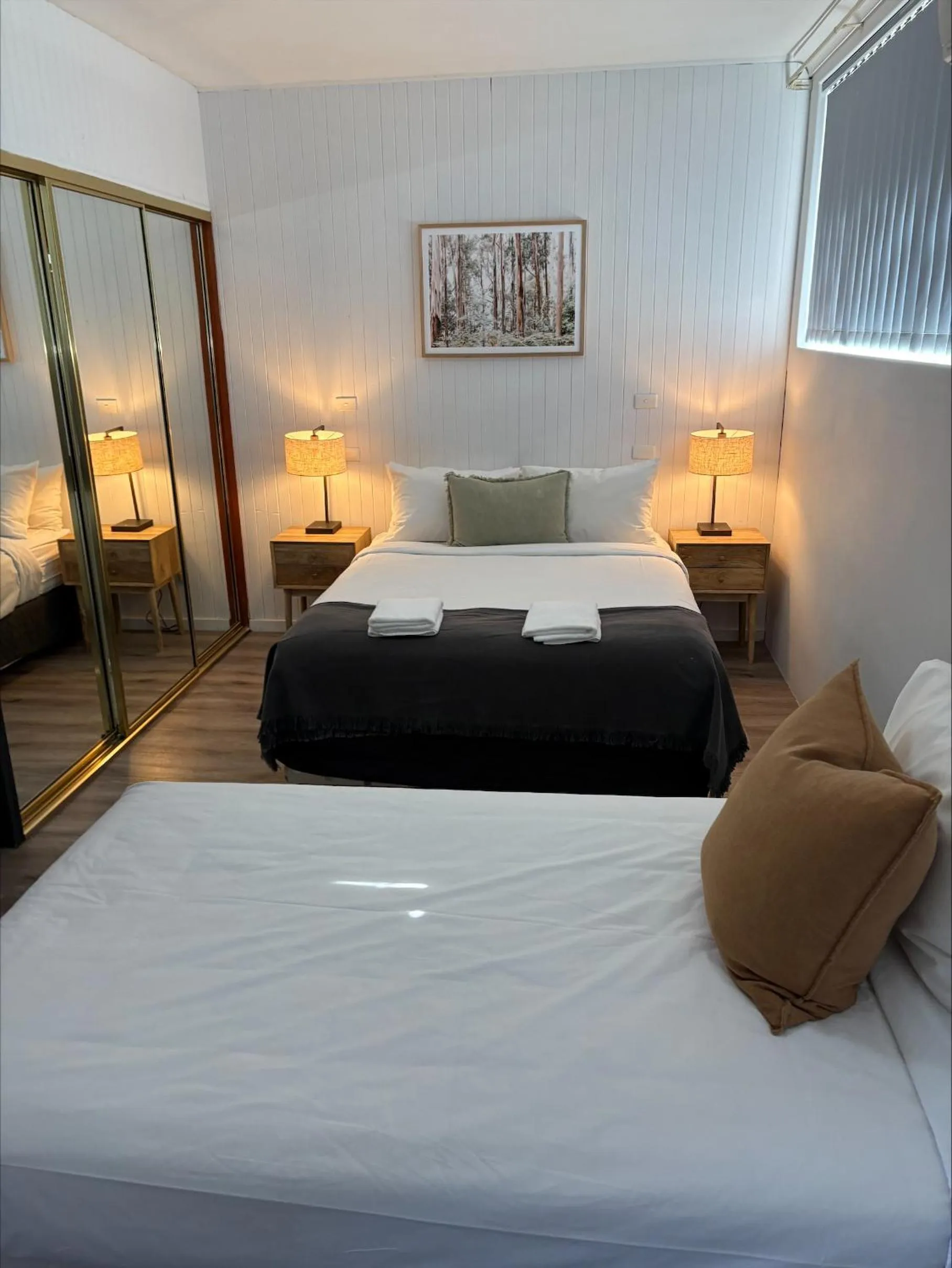 Bed in Tall Timbers Motel