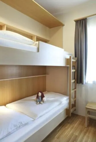 Photo of the whole room, Bed in JUFA Hotel Kaprun - Summercard included