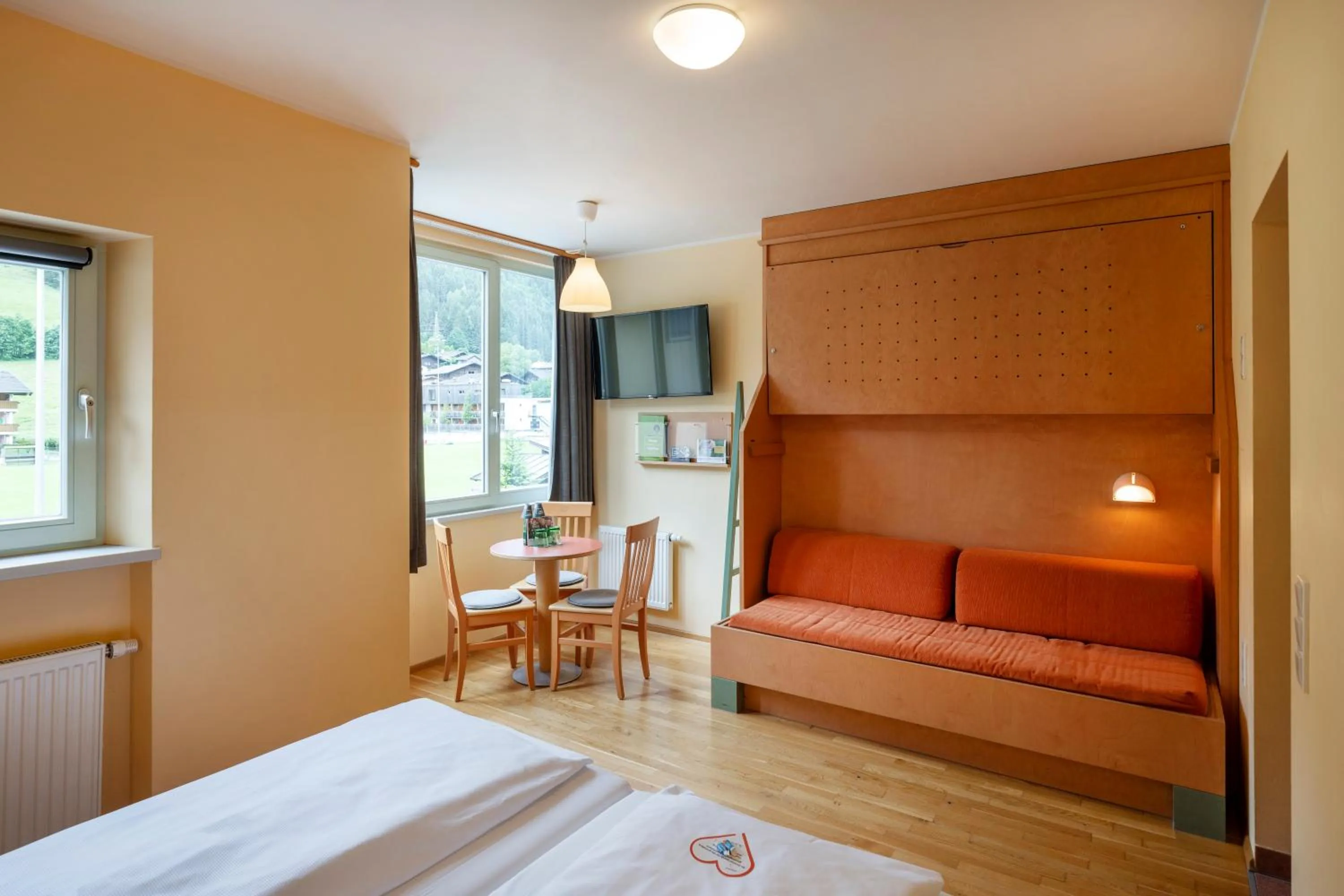 Photo of the whole room, Bed in JUFA Hotel Kaprun - Summercard included