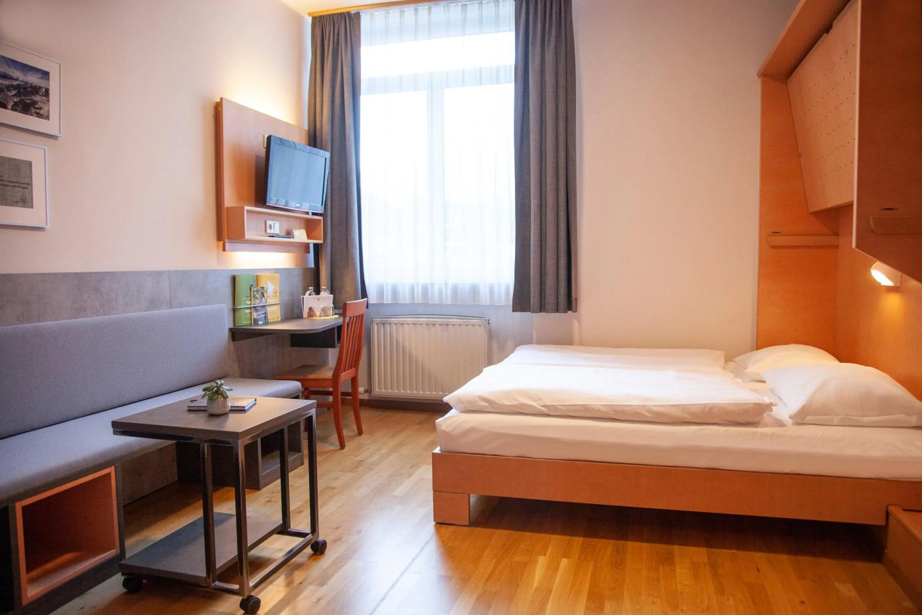 Bed in JUFA Hotel Kaprun - Summercard included