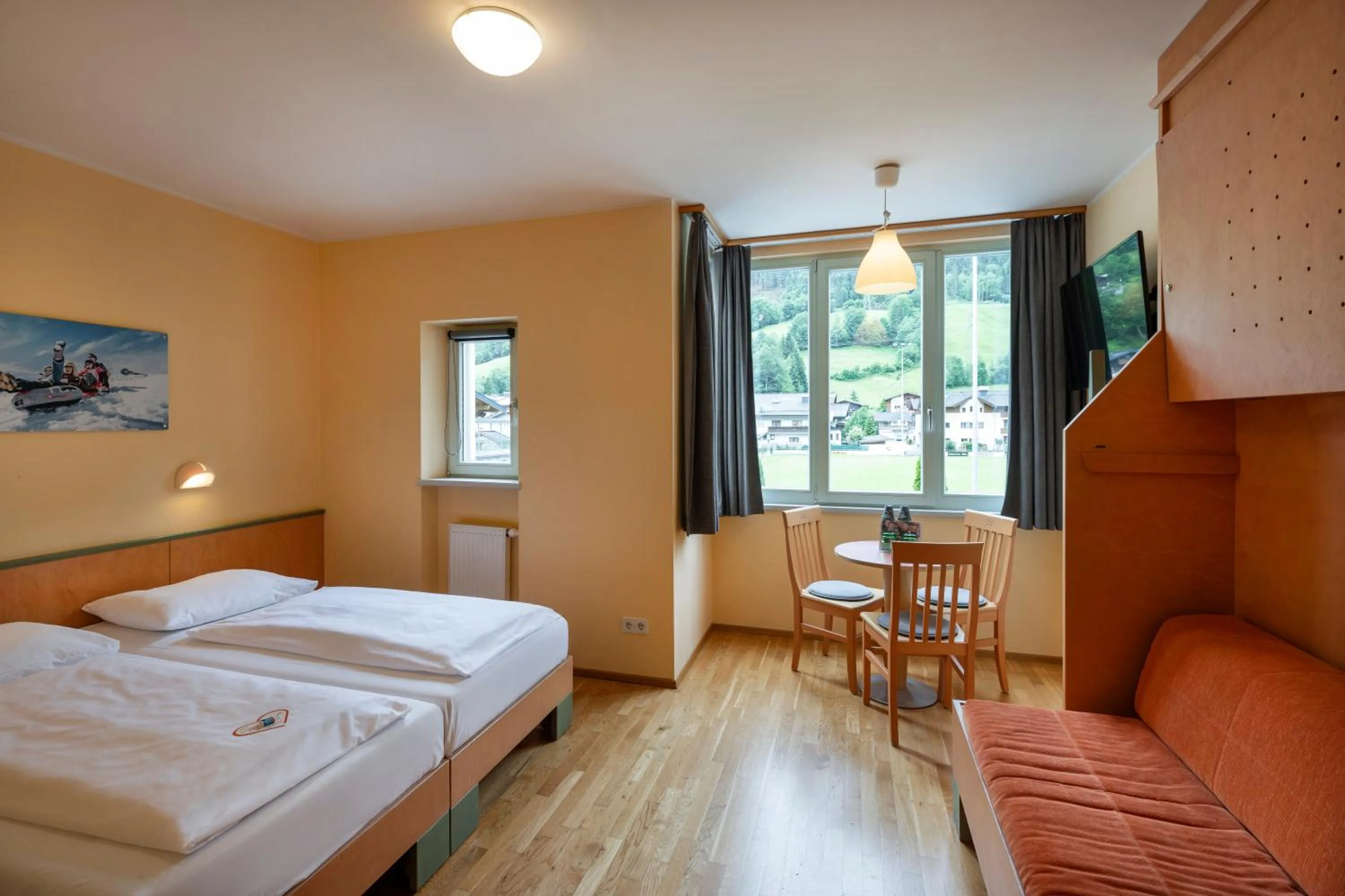 Photo of the whole room, Bed in JUFA Hotel Kaprun - Summercard included