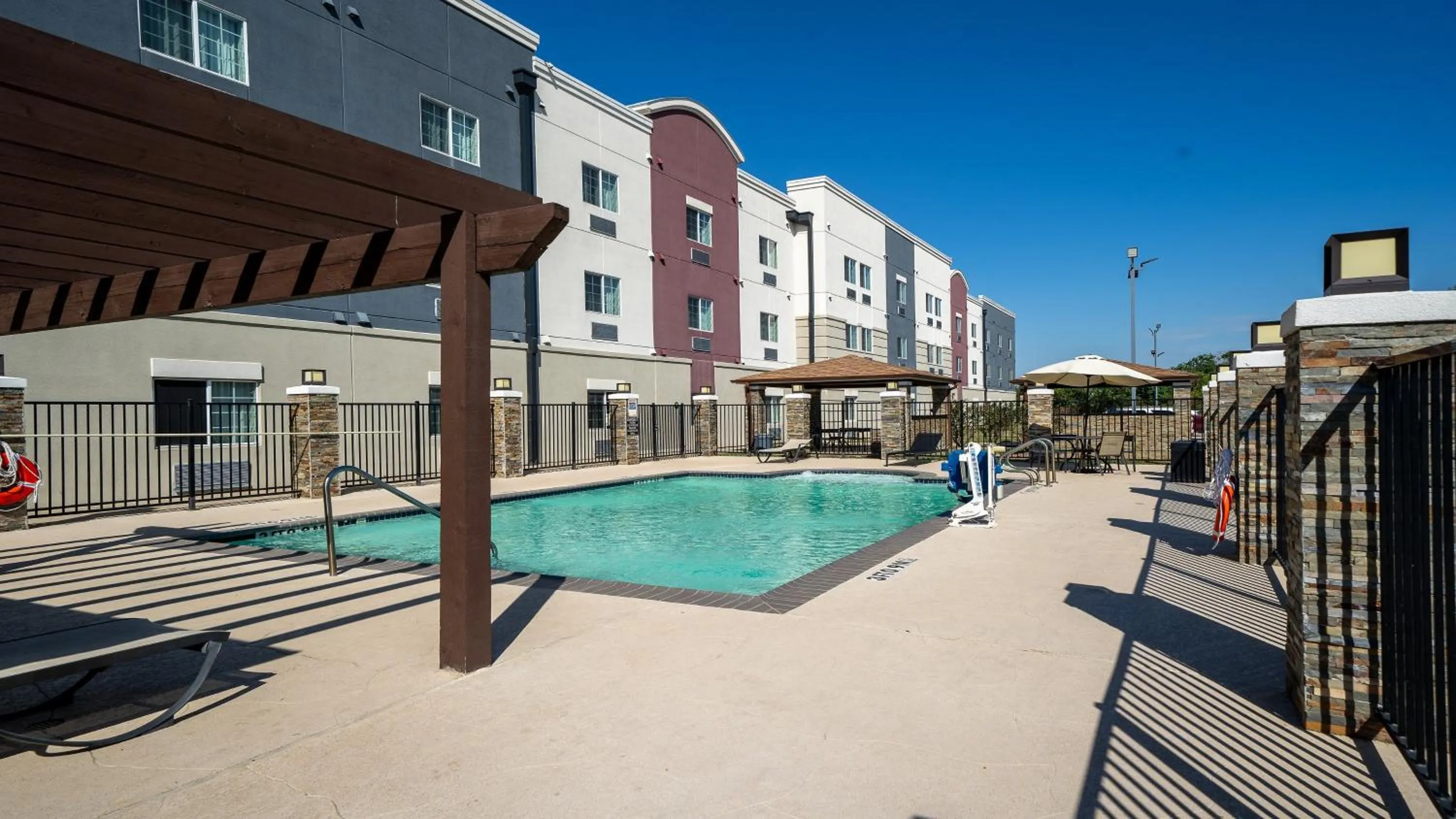 Swimming pool in Candlewood Suites Baytown by IHG