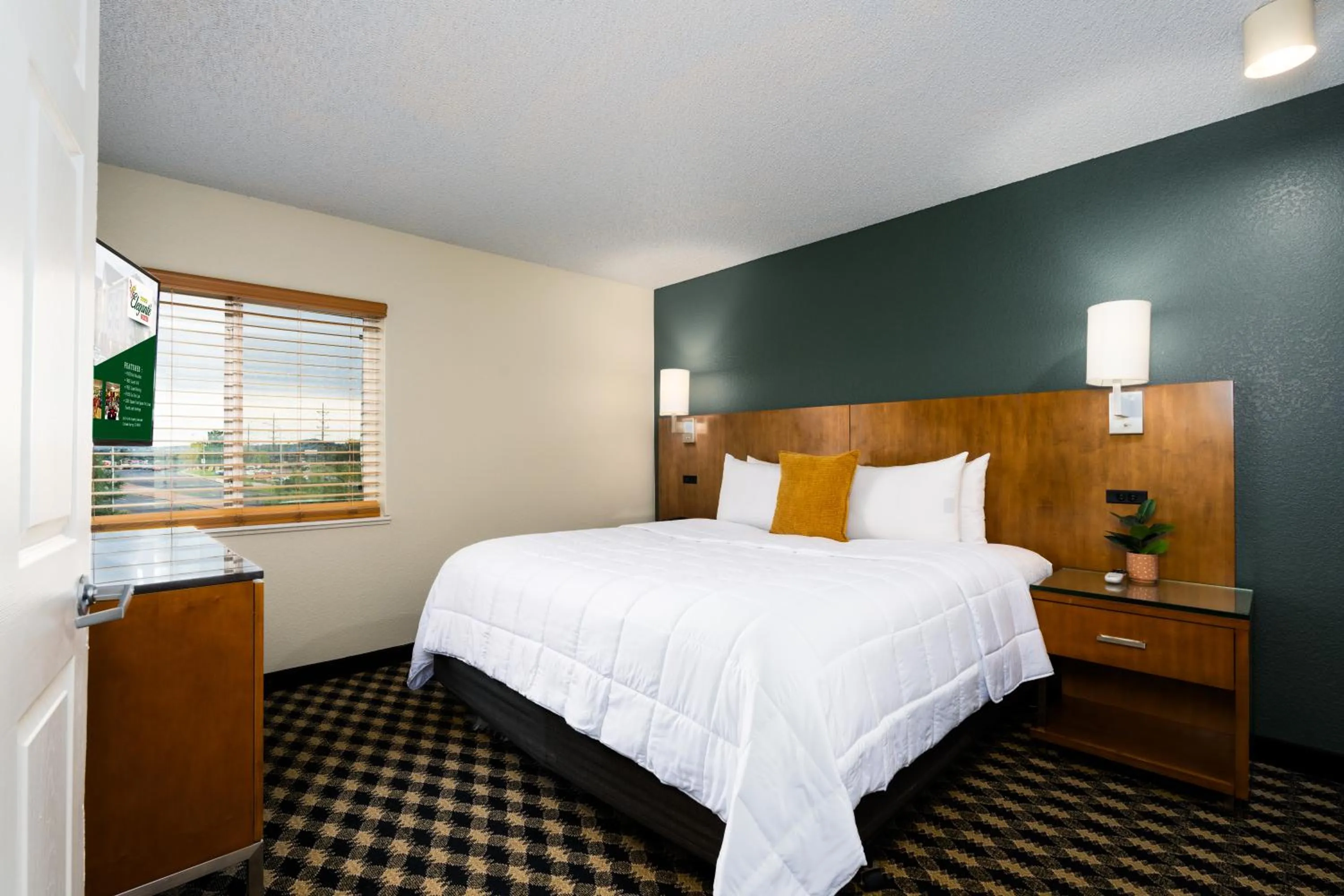 Bed in MCM Elegante Suites