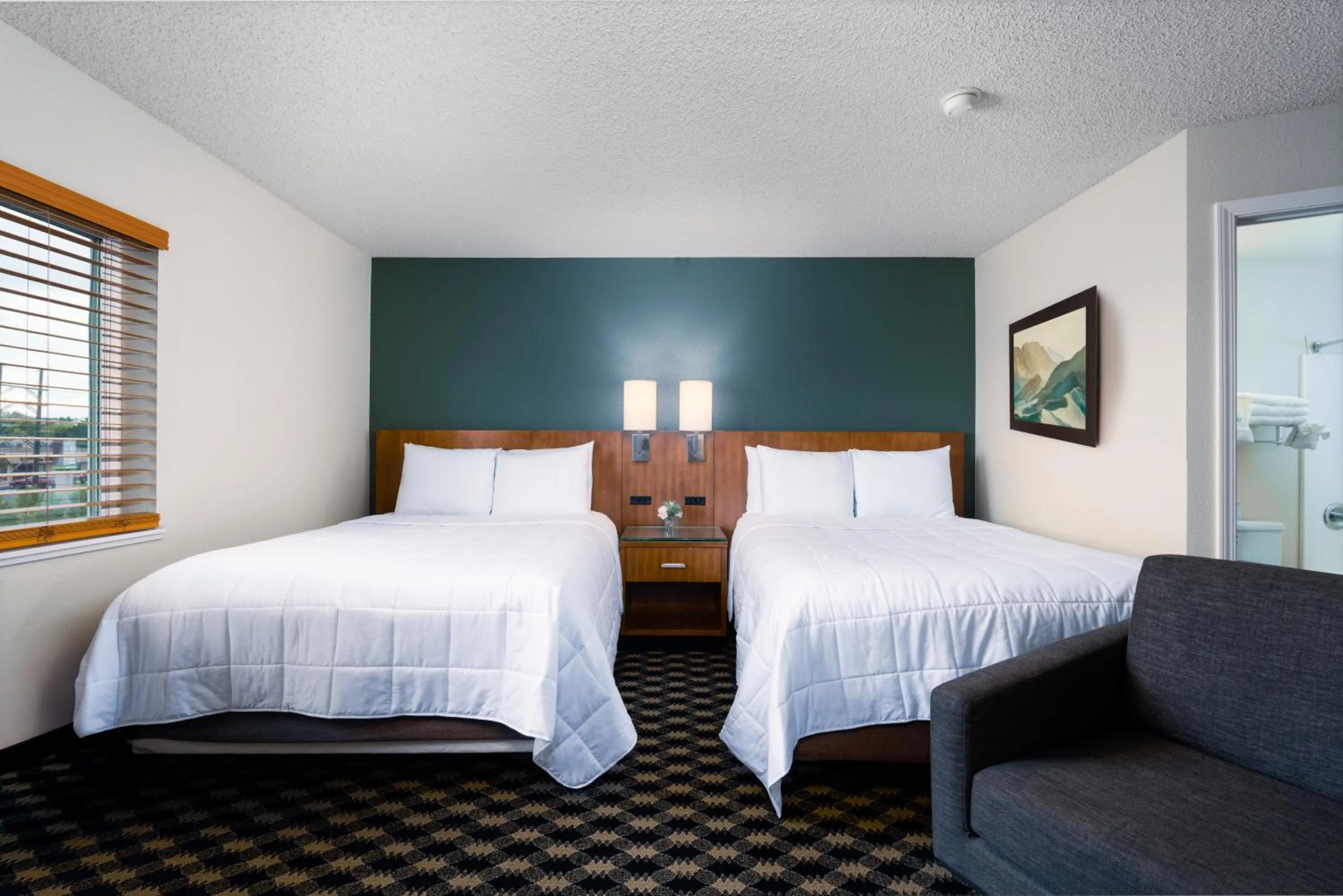 Bed in MCM Elegante Suites