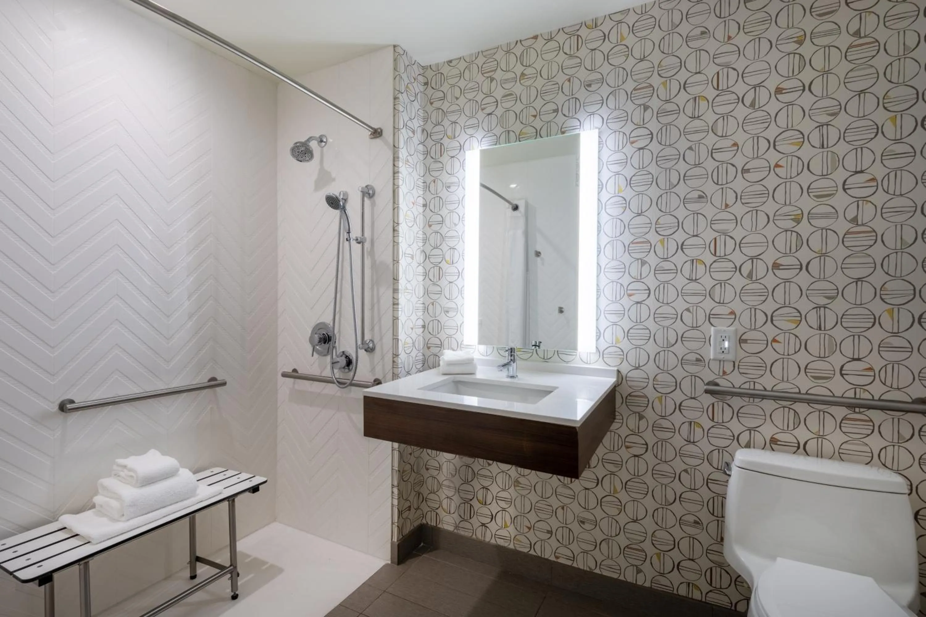 Bathroom in Holiday Inn - Long Island - ISLIP Arpt East by IHG