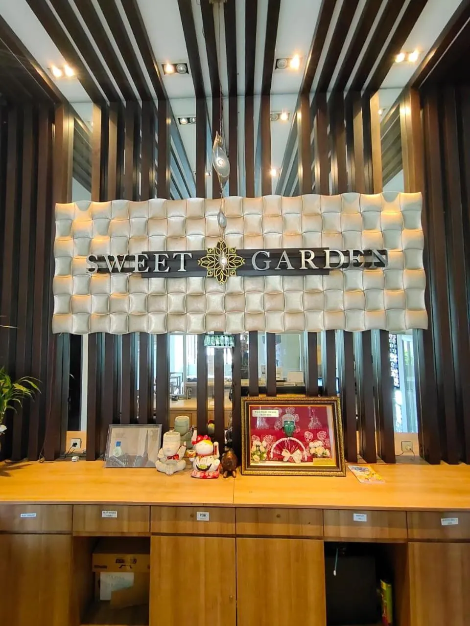 Property logo or sign in Sweet Garden Guest House