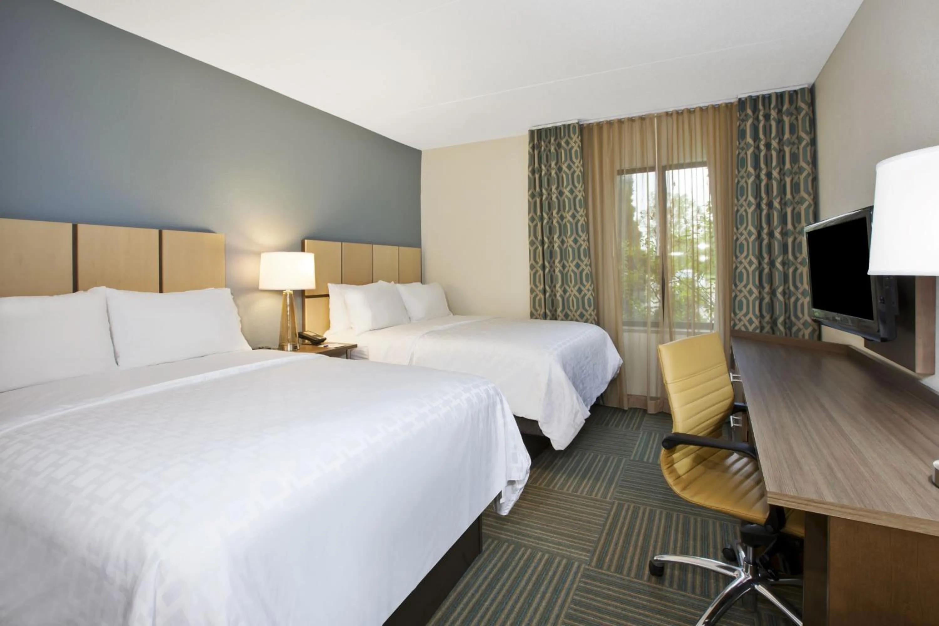 Photo of the whole room, Bed in Candlewood Suites Grand Rapids Airport by IHG