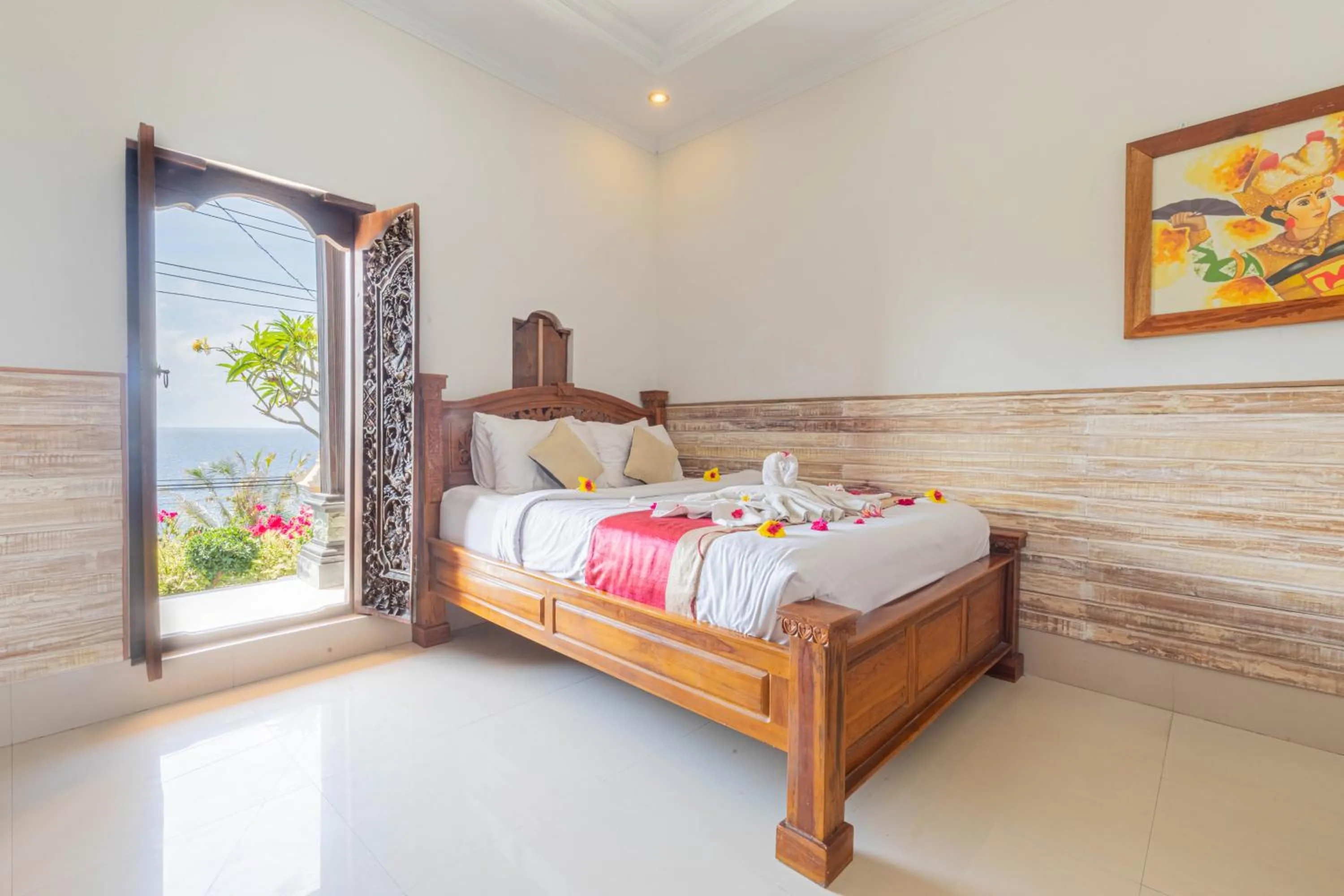 Bed in Manta Cottages with Sea View