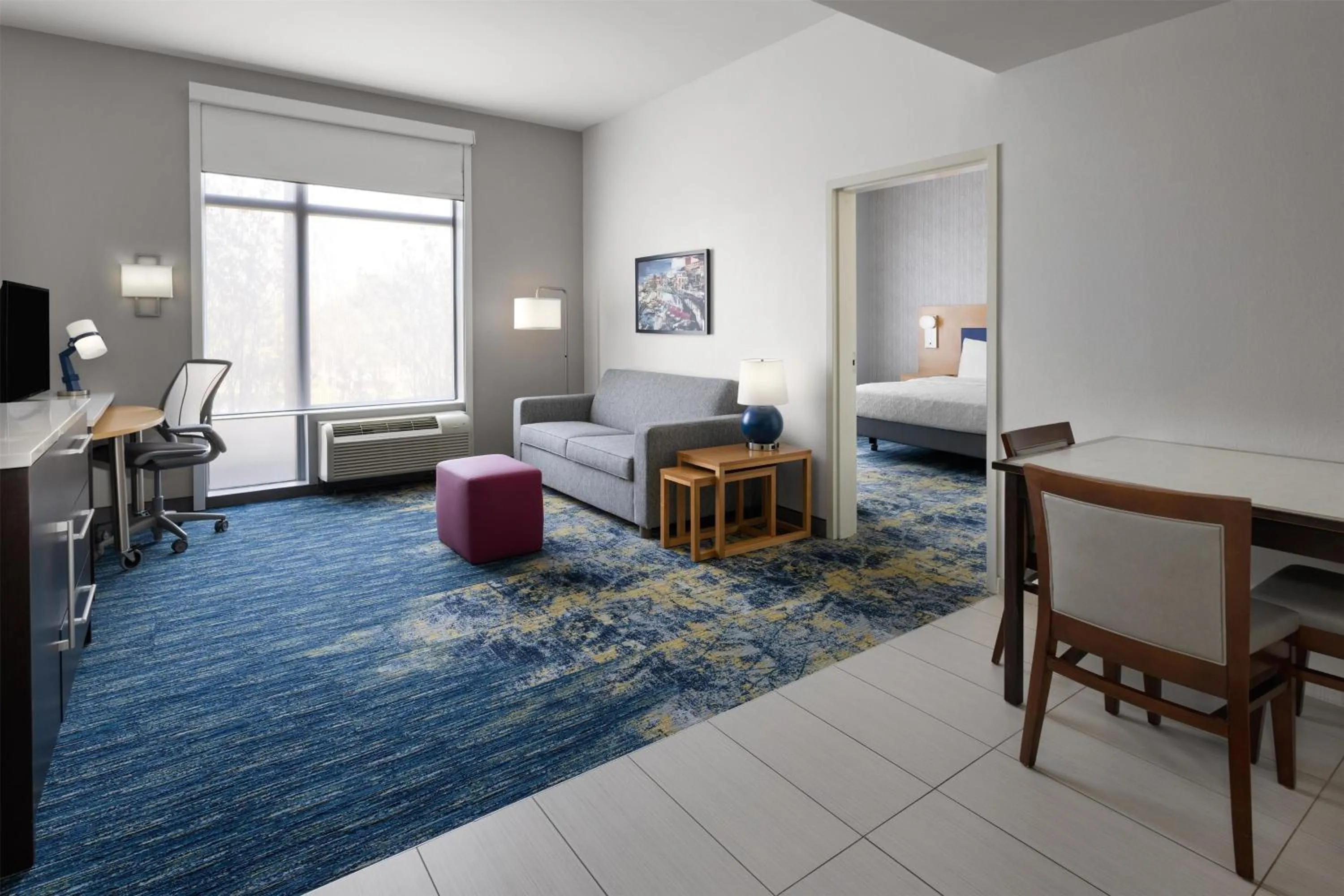 Living room, Bed in Home2 Suites by Hilton Greenville Downtown