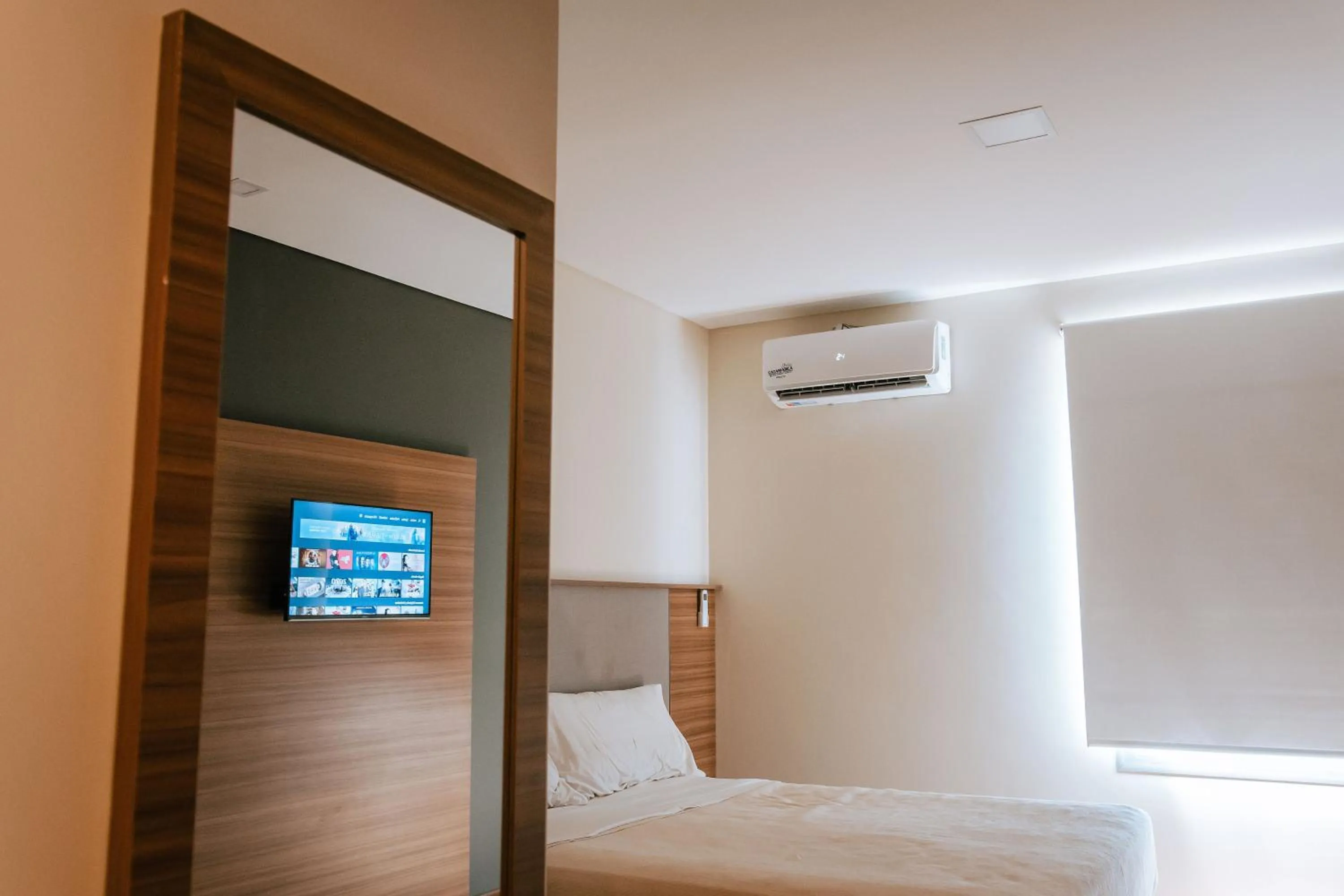 Bed in H1 Apartments Hotel