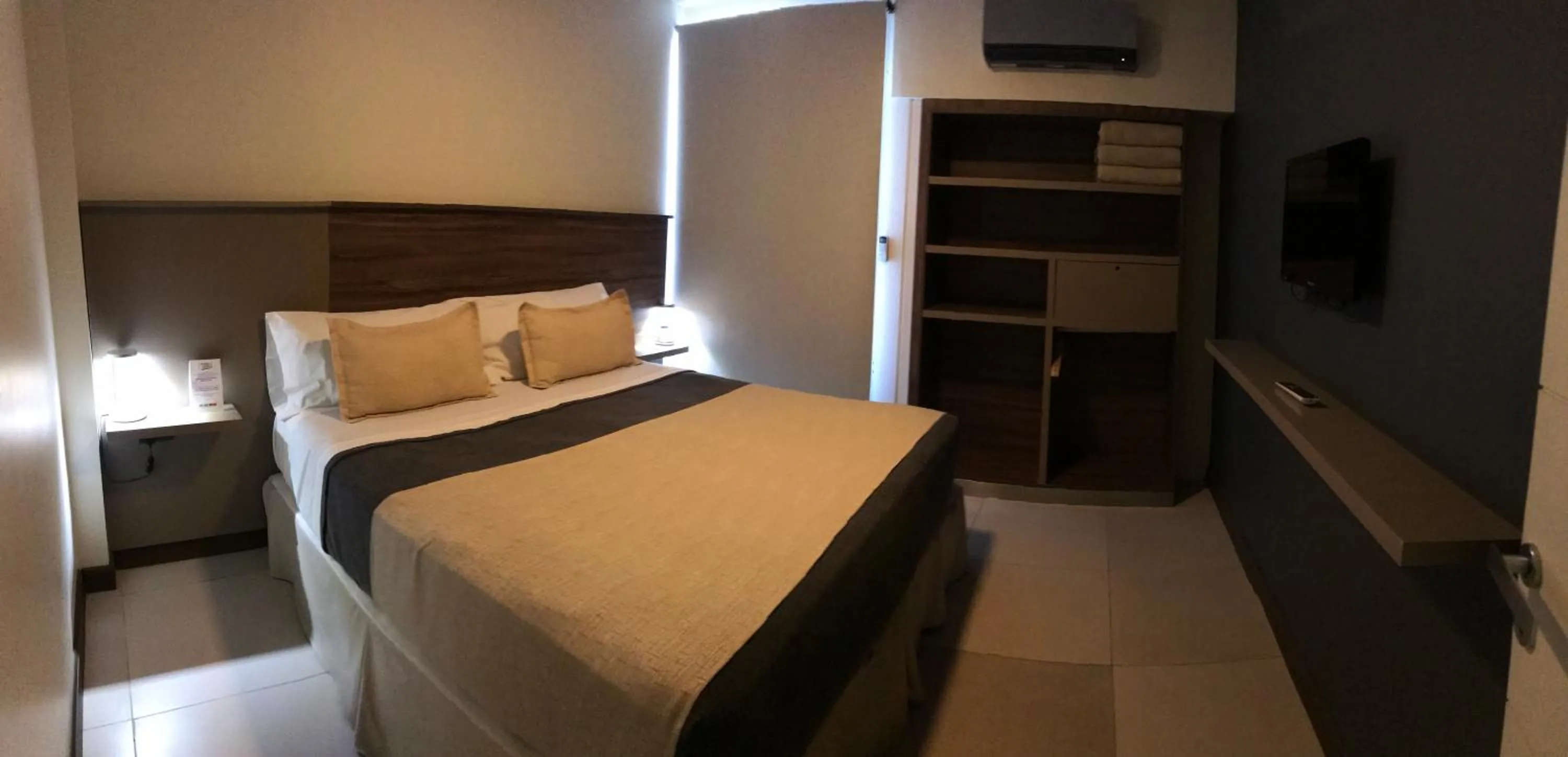 Bed in H1 Apartments Hotel