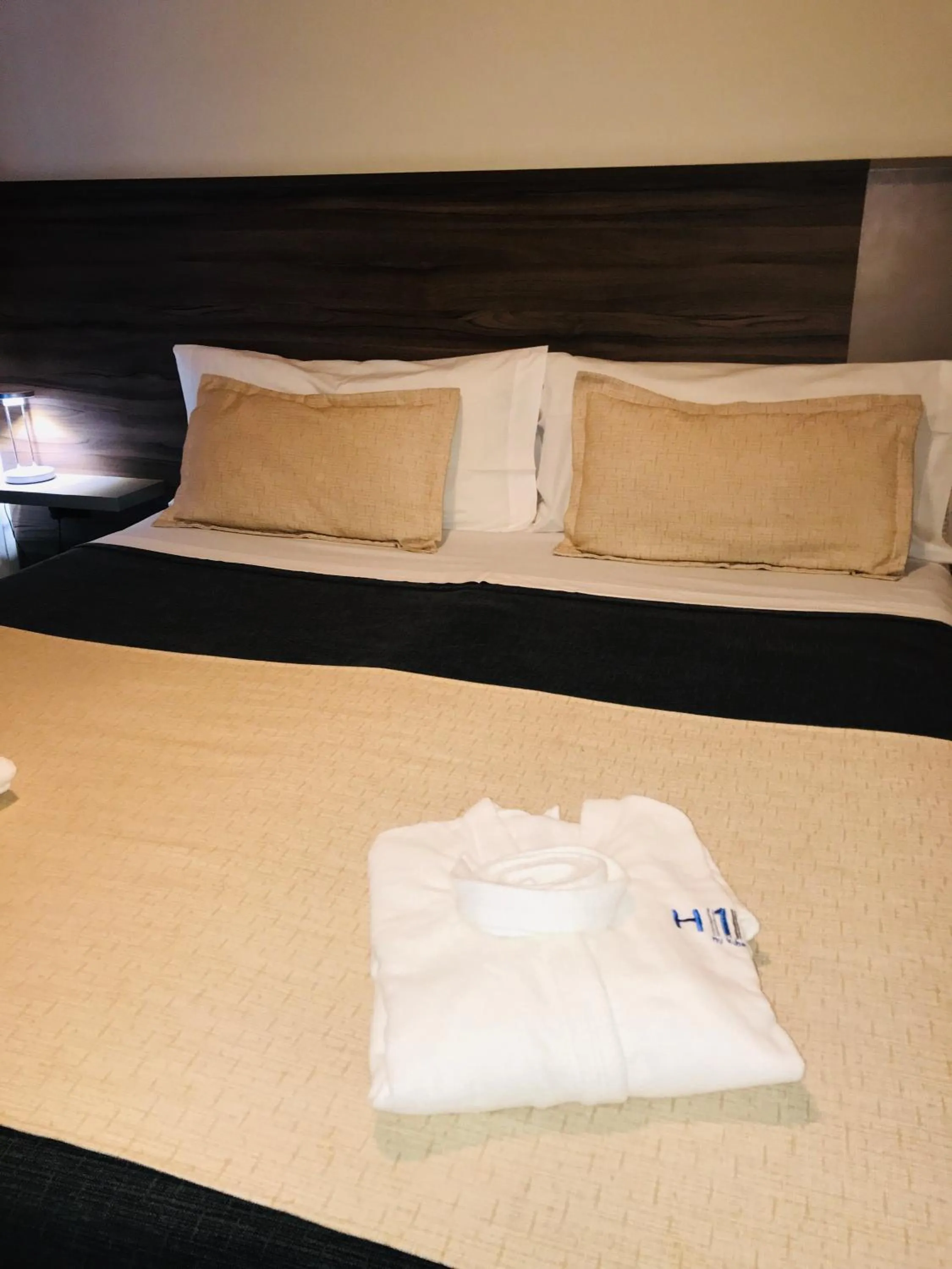 Bed in H1 Apartments Hotel