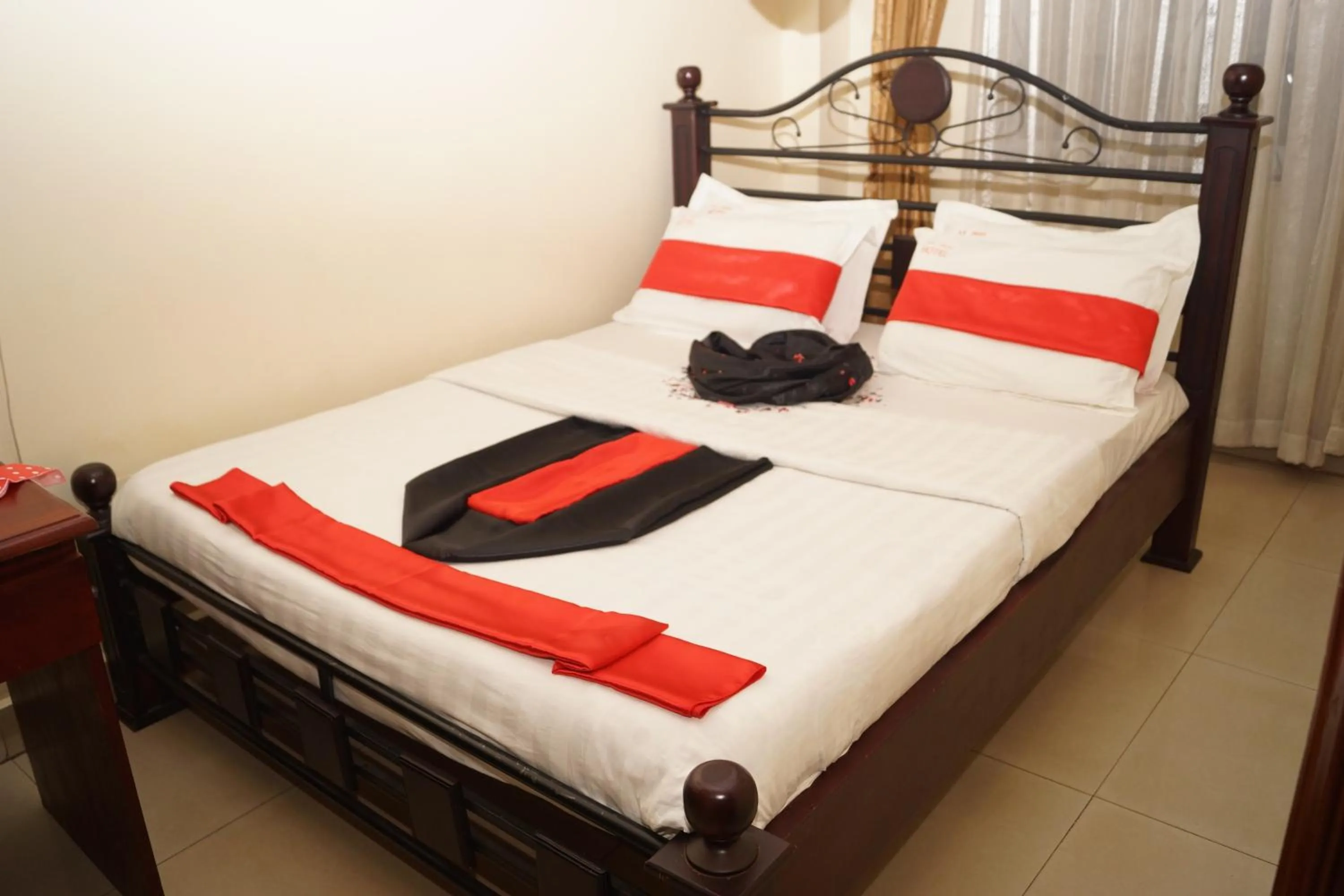 Bedroom in KK Trust Hotel Kampala