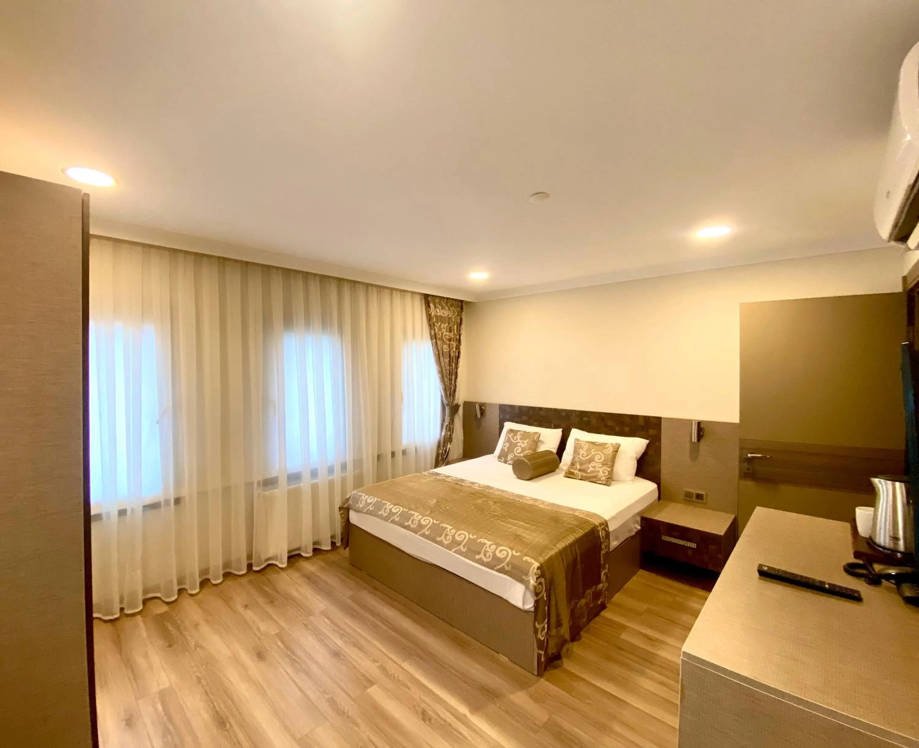 Bed in Caykent Suites Deluxe Hotel
