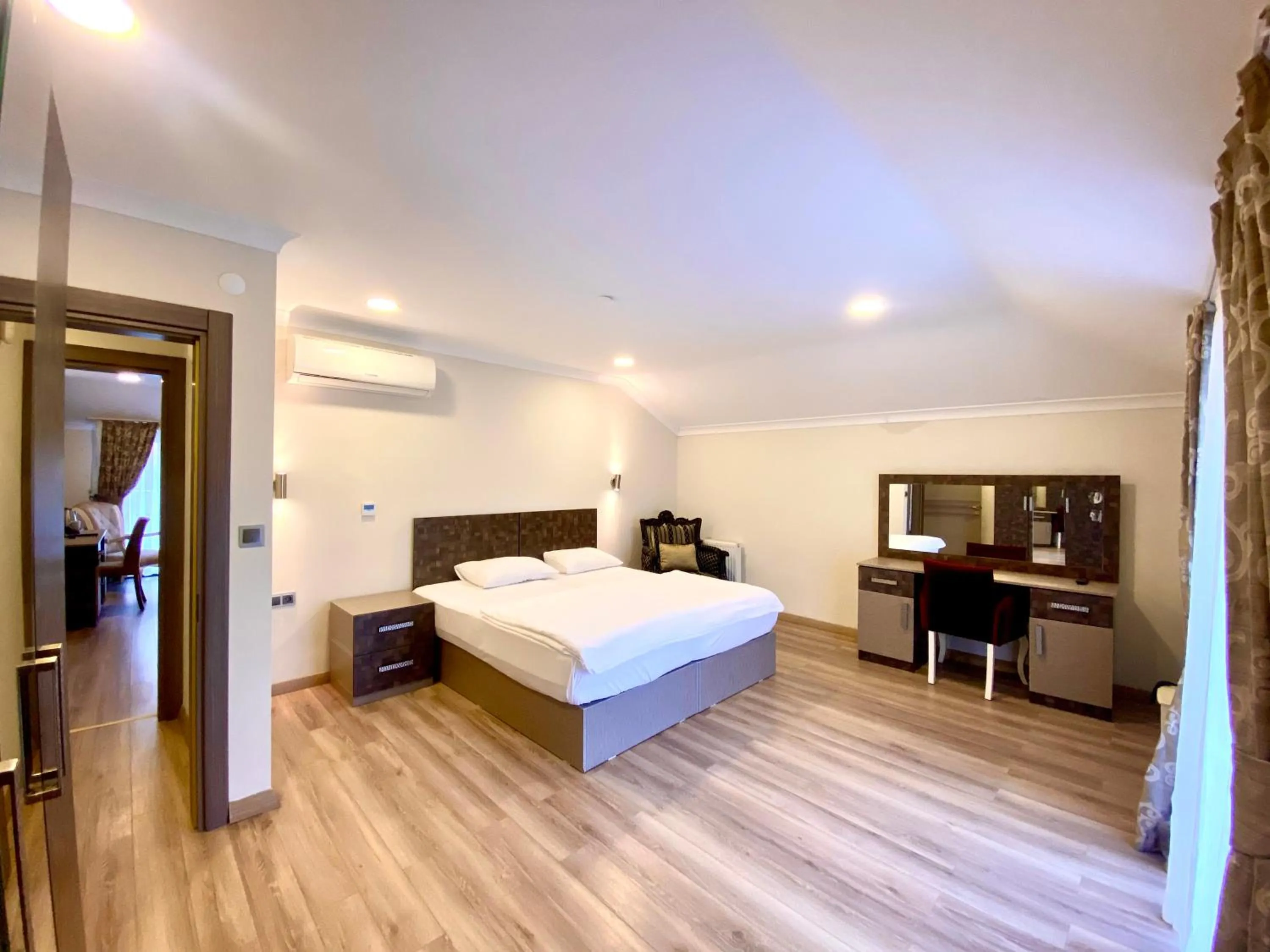 Bed in Caykent Suites Deluxe Hotel