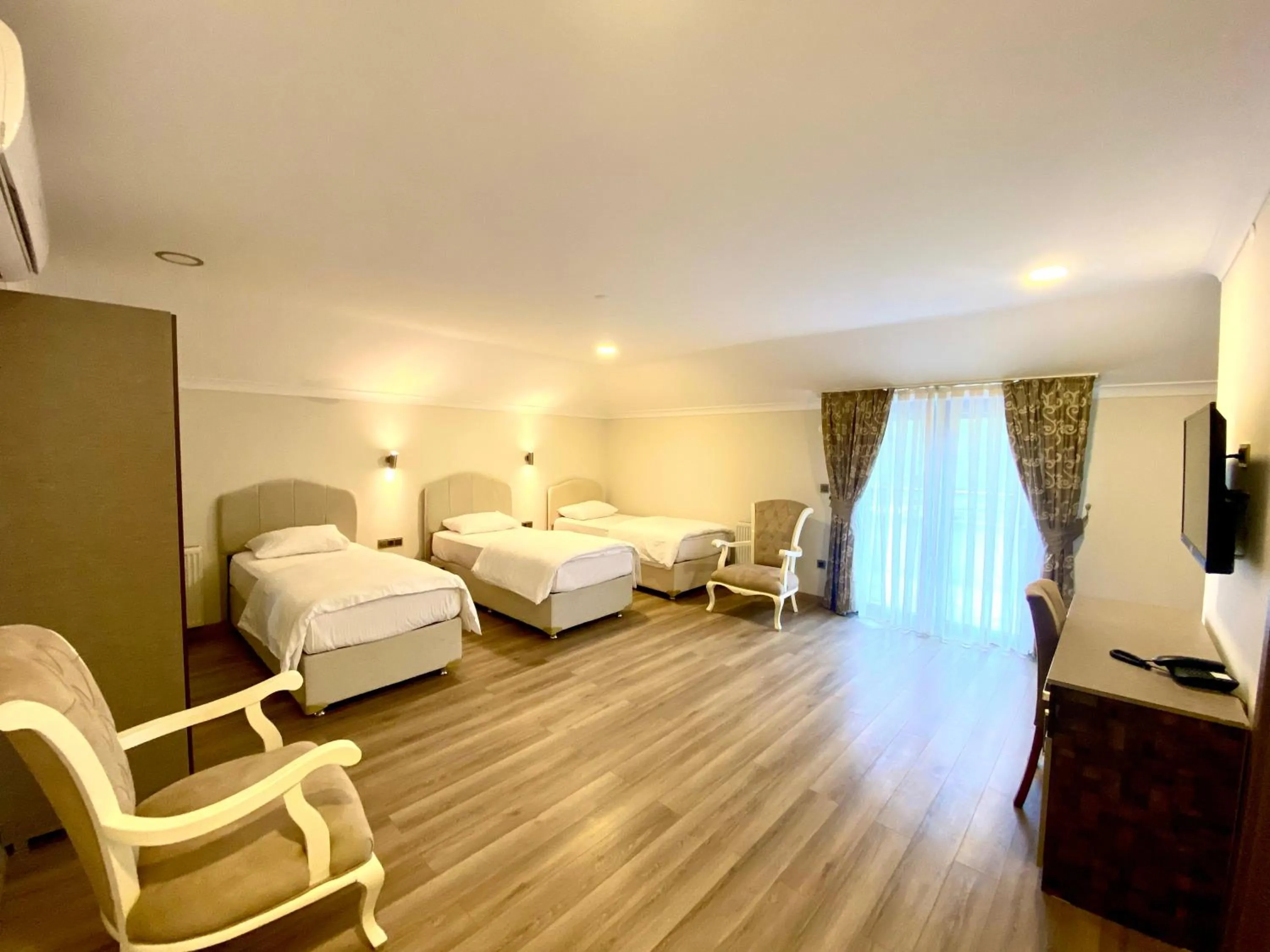 Bed in Caykent Suites Deluxe Hotel