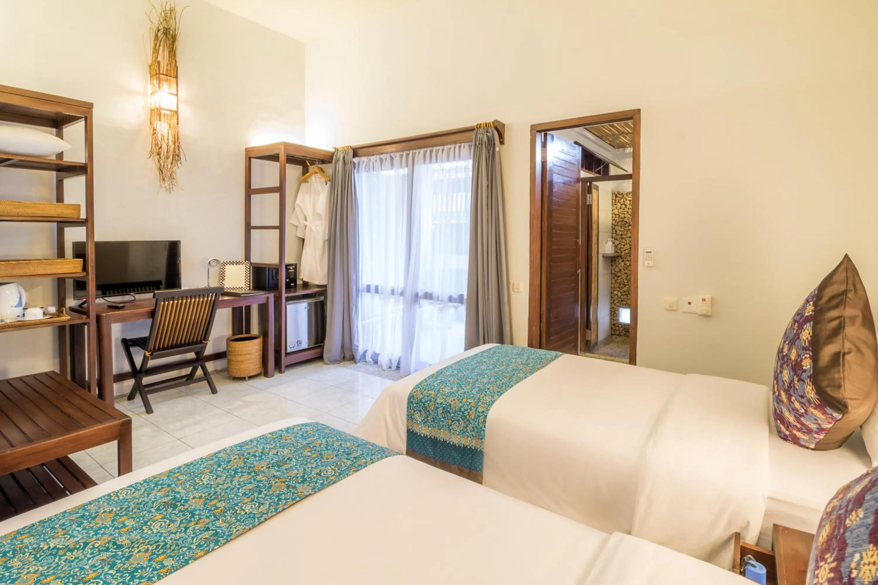 Bed in Cocotinos Lembeh a Boutique Dive Lodge