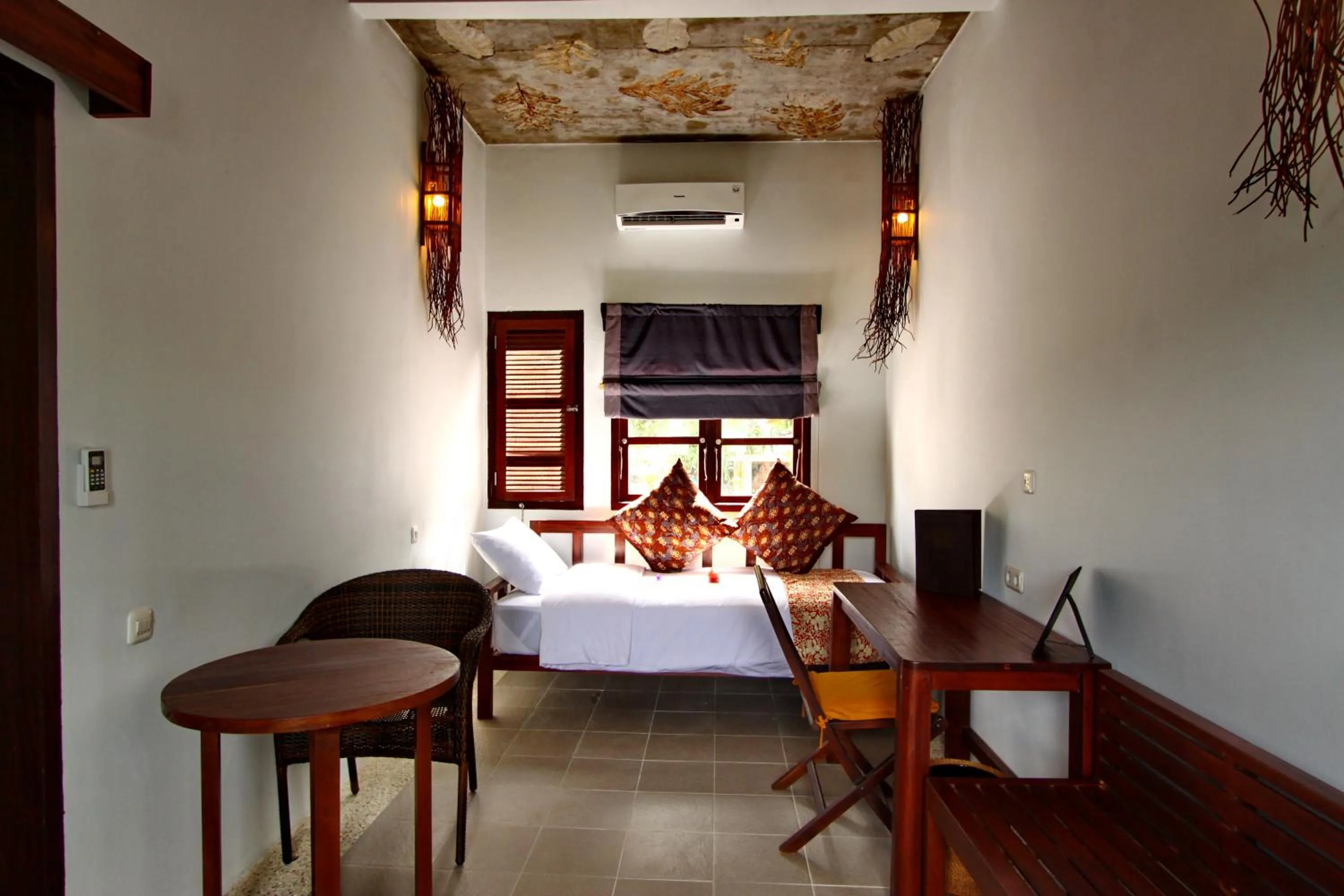 Bed in Cocotinos Lembeh a Boutique Dive Lodge