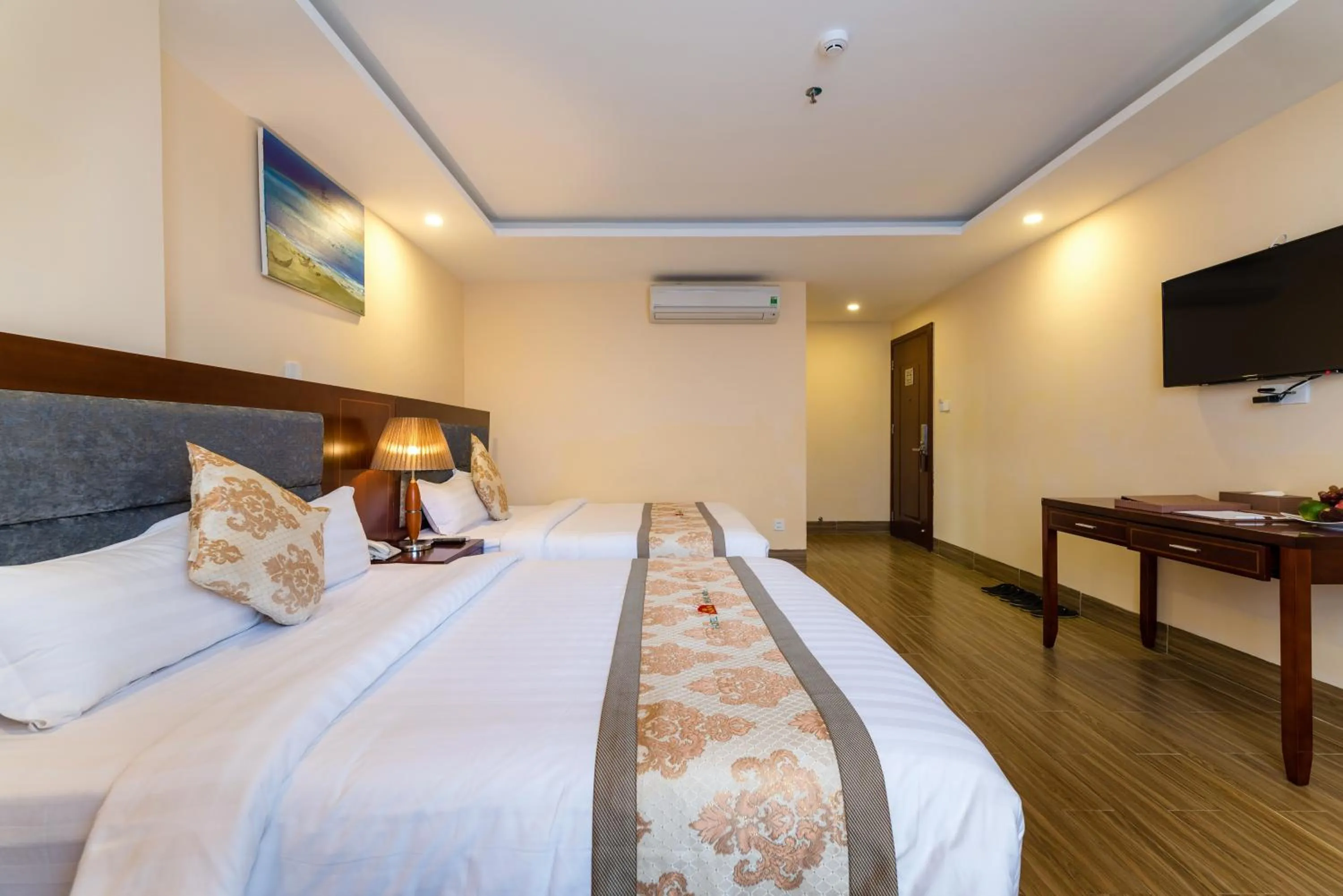 Living room, Bed in Nhat Minh Hotel and Apartment