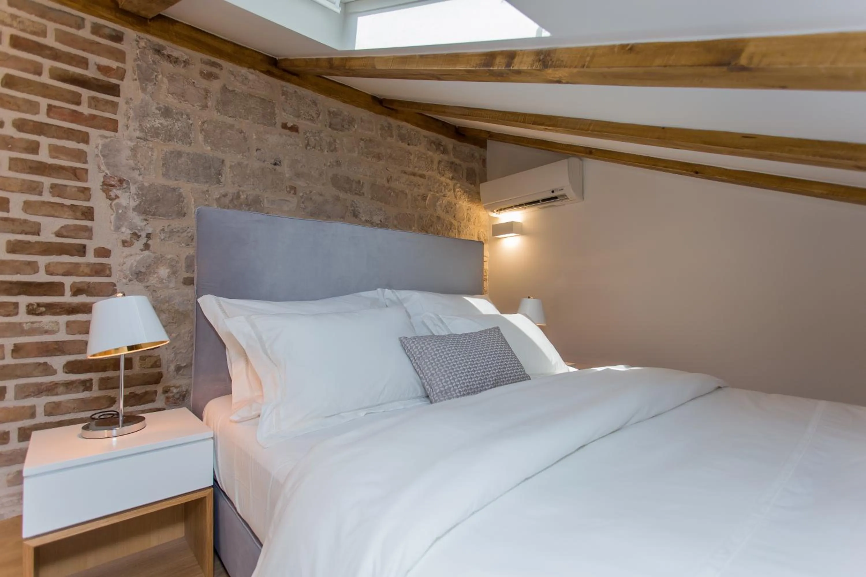 Bed in Bifora Heritage Hotel