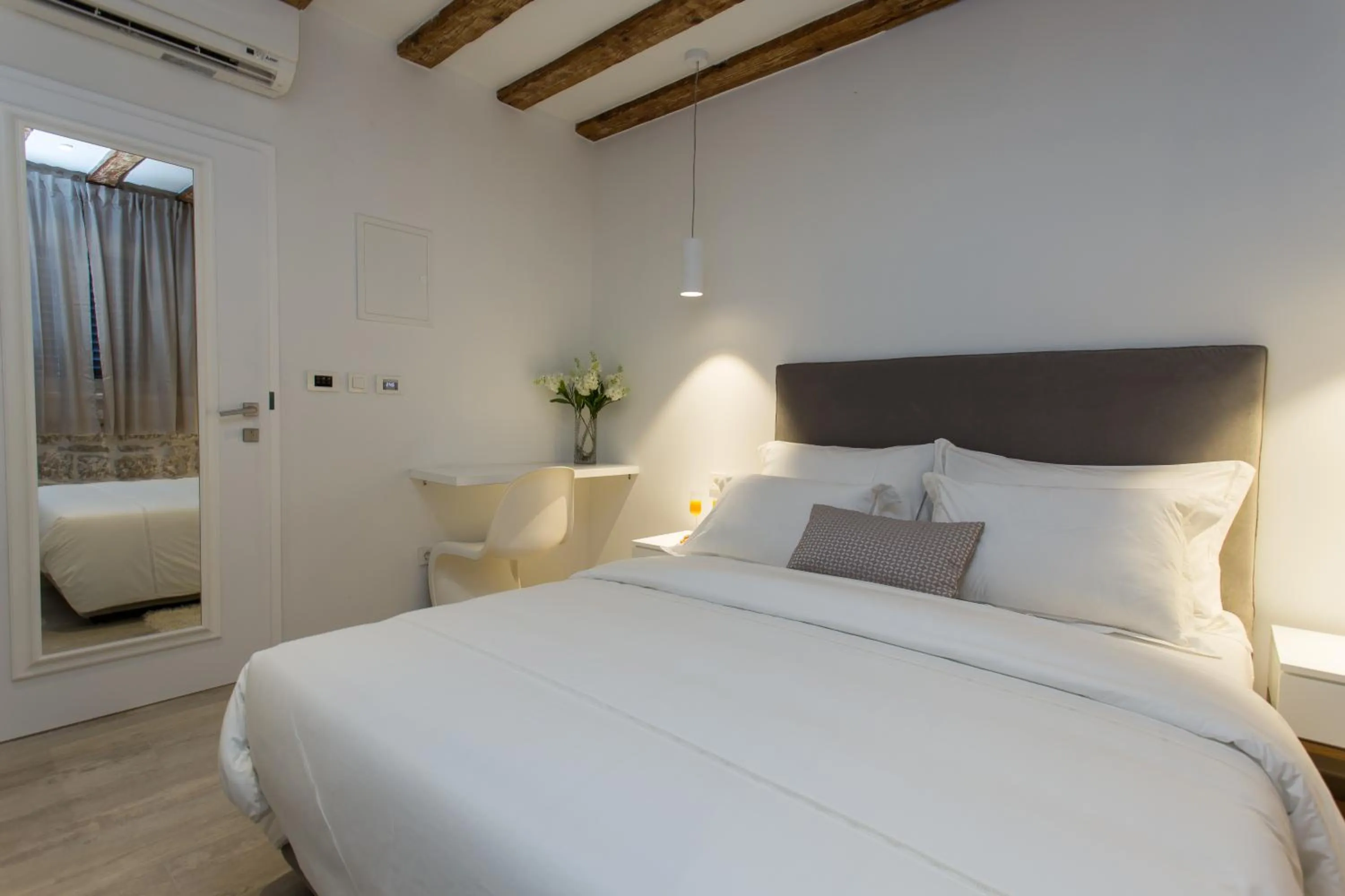 Bed in Bifora Heritage Hotel