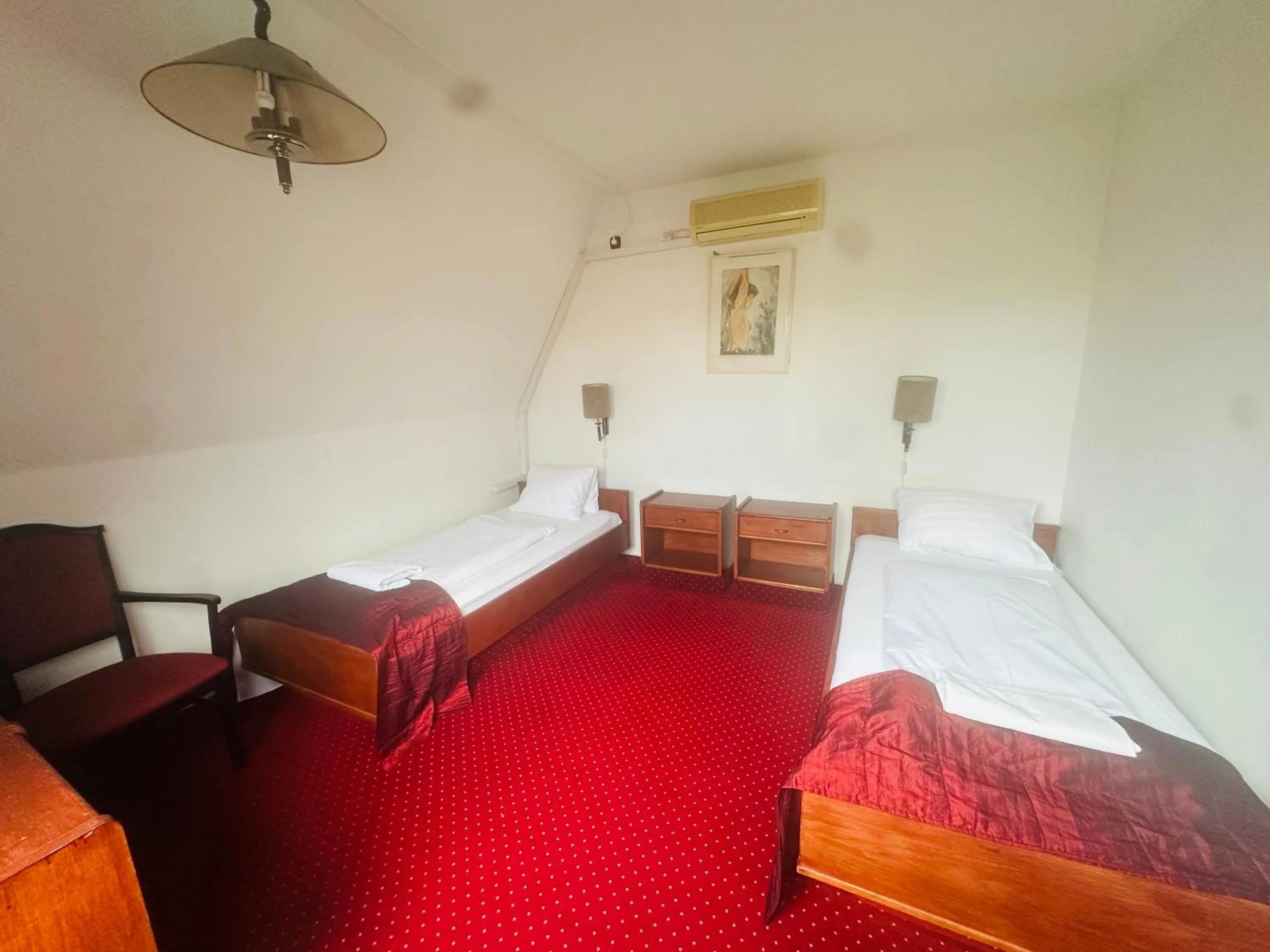 Bed in Hotel Amadeus