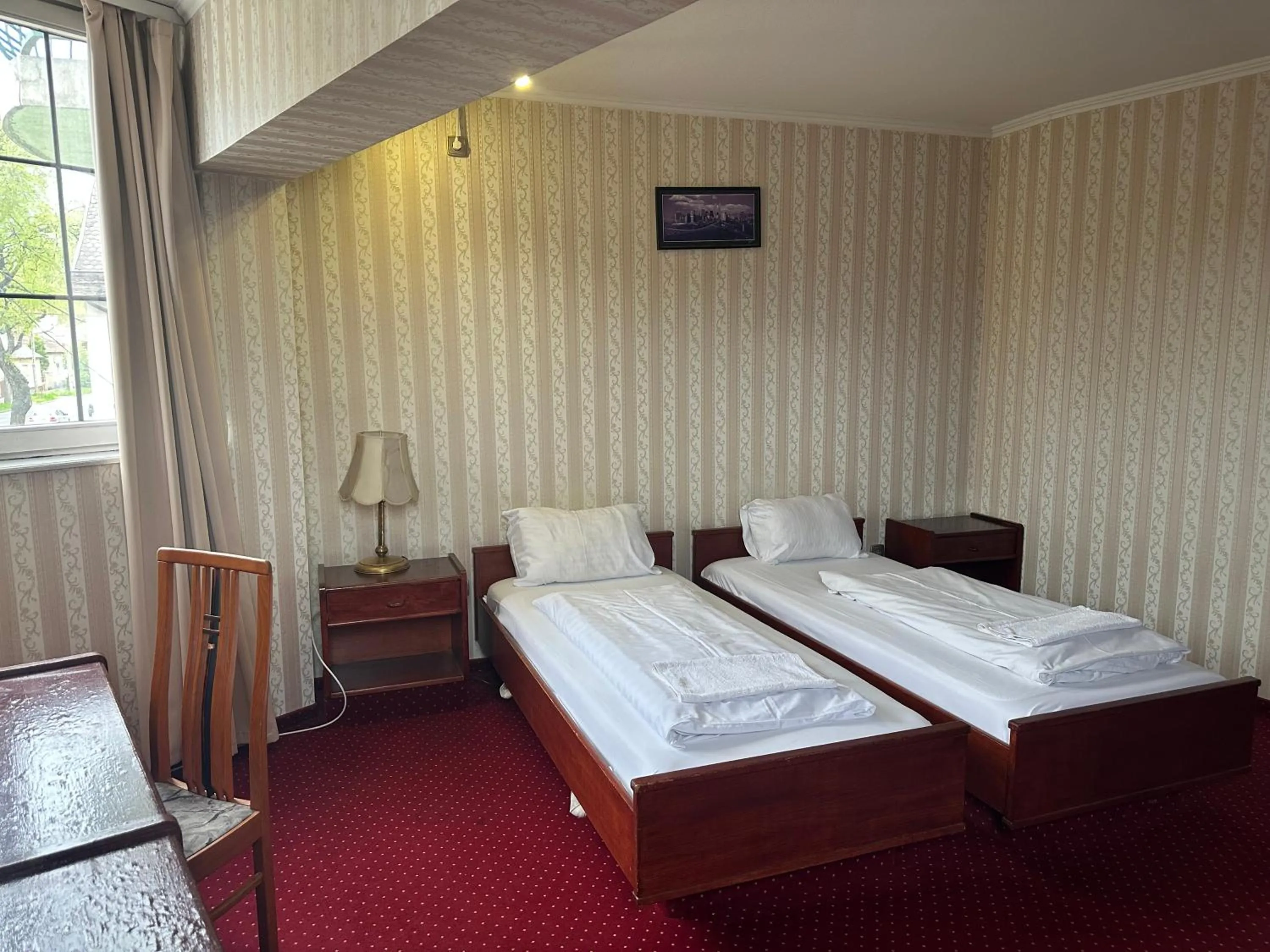 Bed in Hotel Amadeus