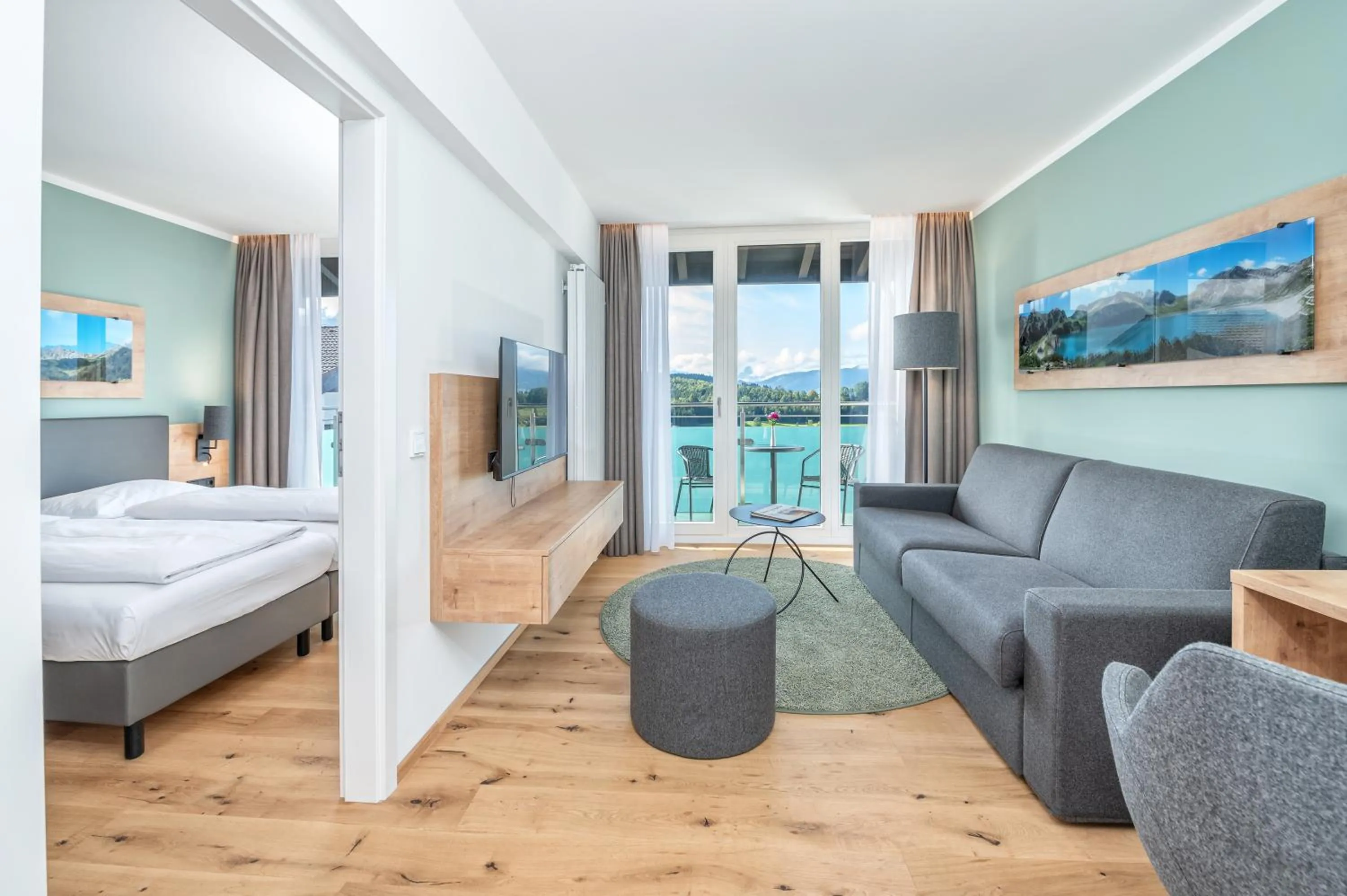 Living room, Bed in AllgäuStern Hotel