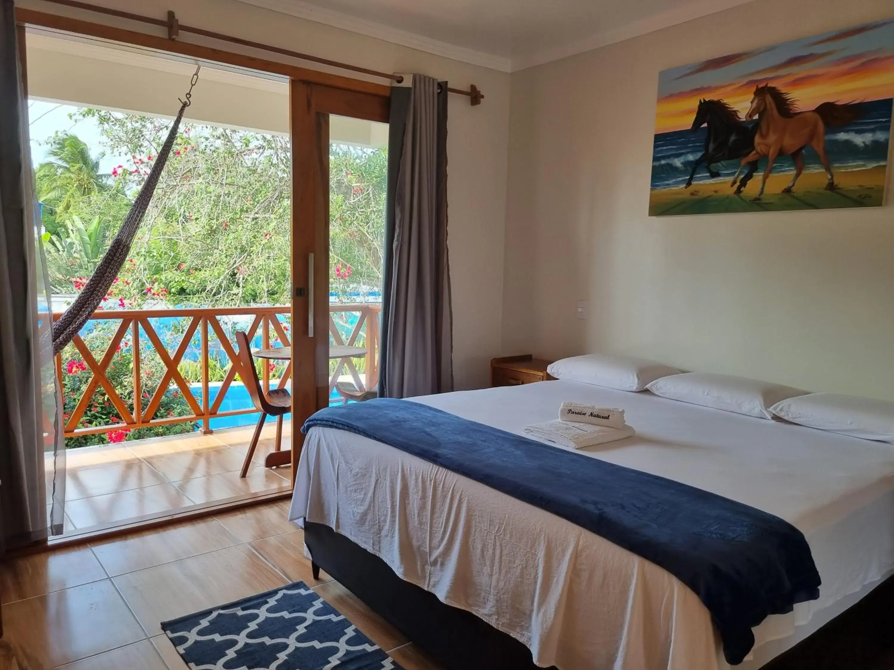 Deluxe Queen Room with Two Queen Beds - single occupancy in Pousada e Restaurante Paraíso Natural Deluxe Queen Room with Two Queen Beds - single occupancy in Pousada e Restaurante Paraíso Natural