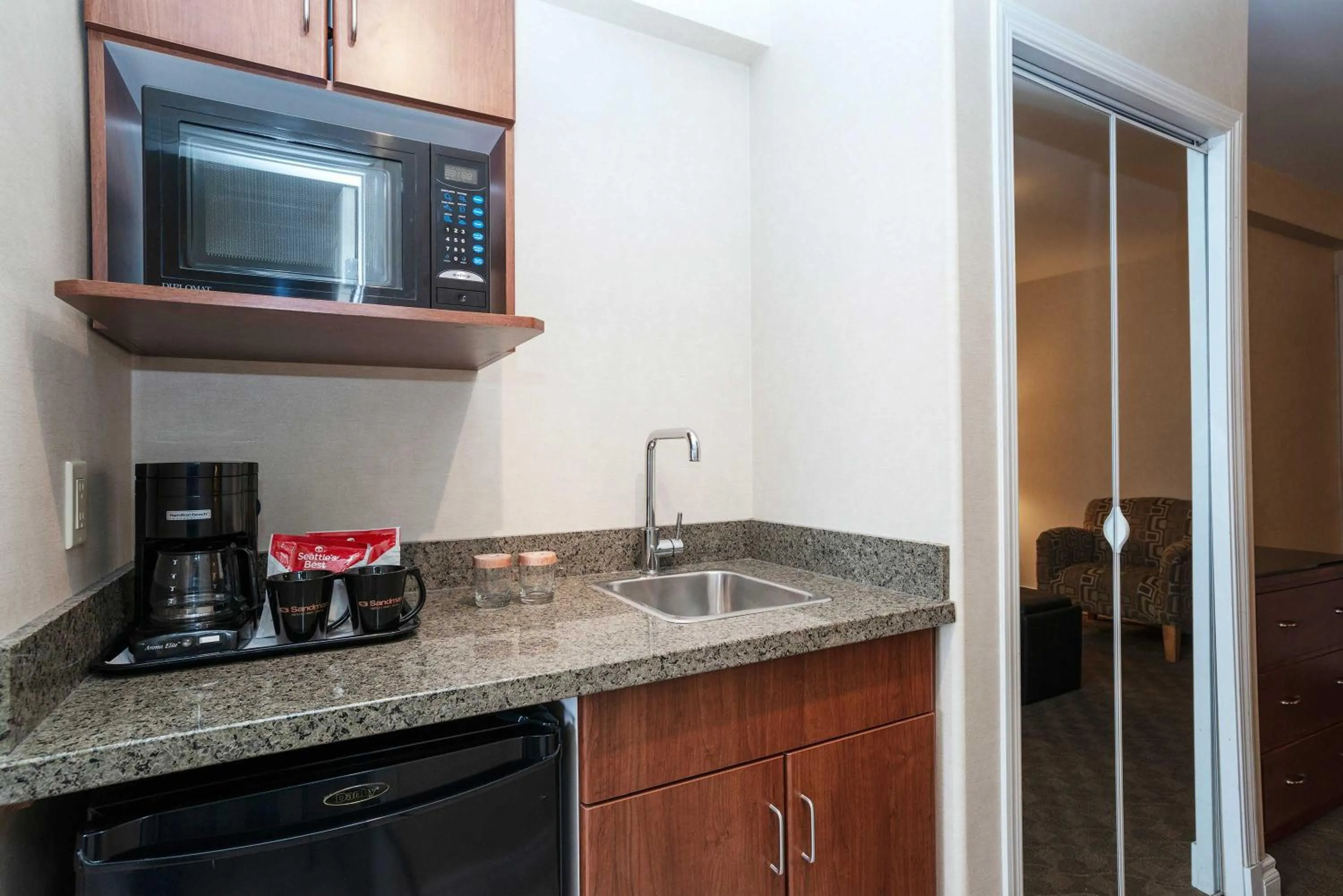 Kitchen or kitchenette in Sandman Hotel & Suites Calgary West