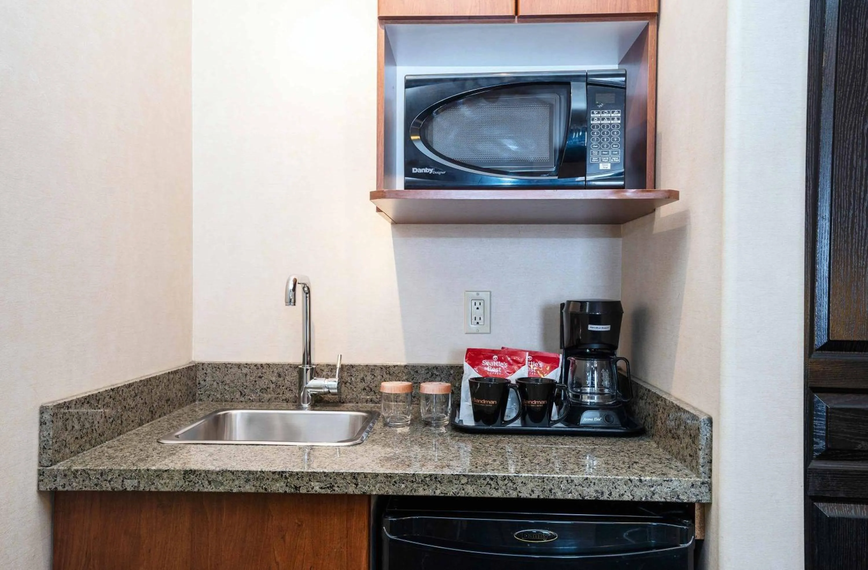 Kitchen or kitchenette in Sandman Hotel & Suites Calgary West