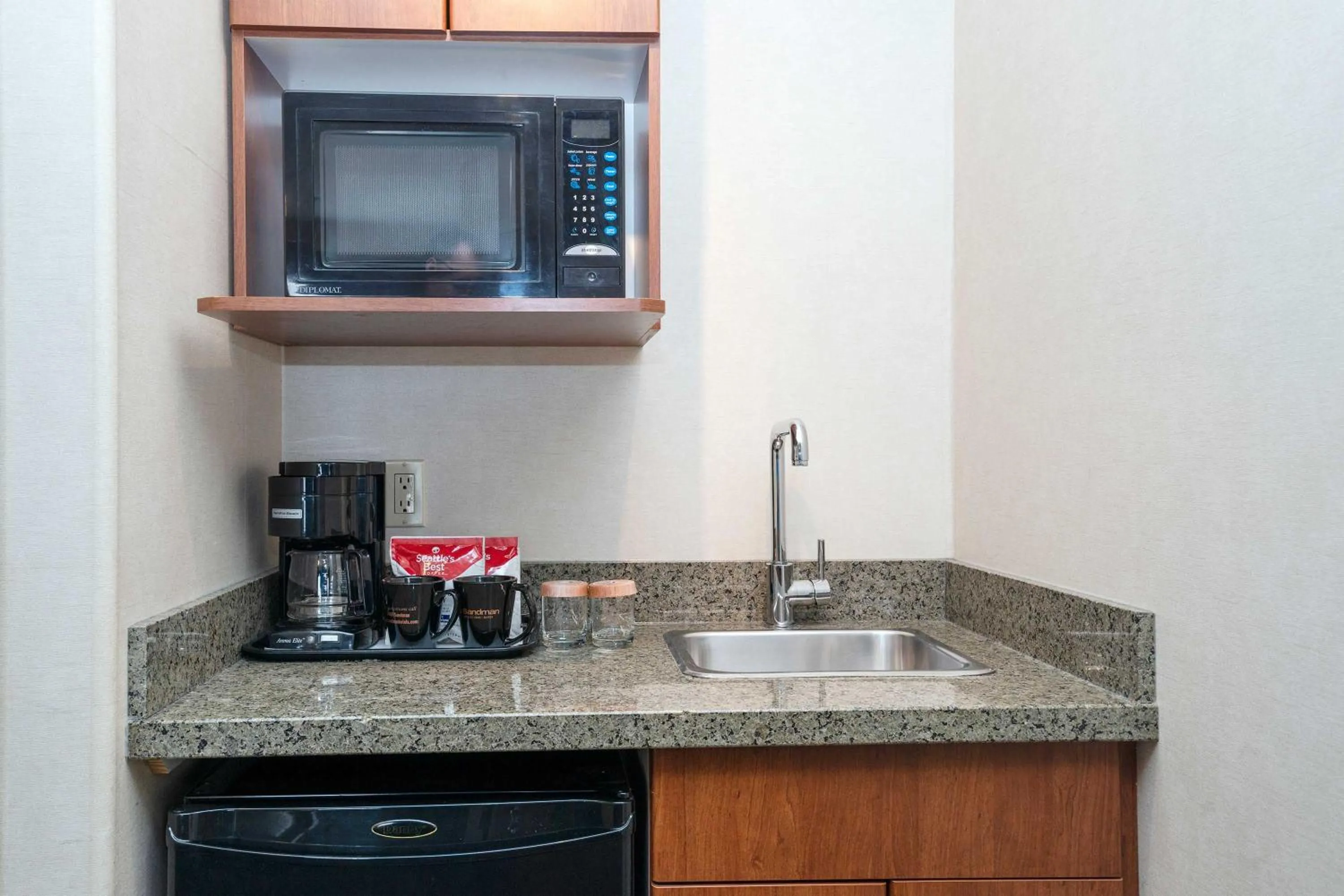 Kitchen or kitchenette in Sandman Hotel & Suites Calgary West