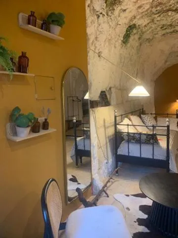 Bed in Les Troglos de la Tufolière