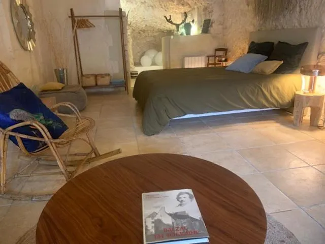 Bed in Les Troglos de la Tufolière