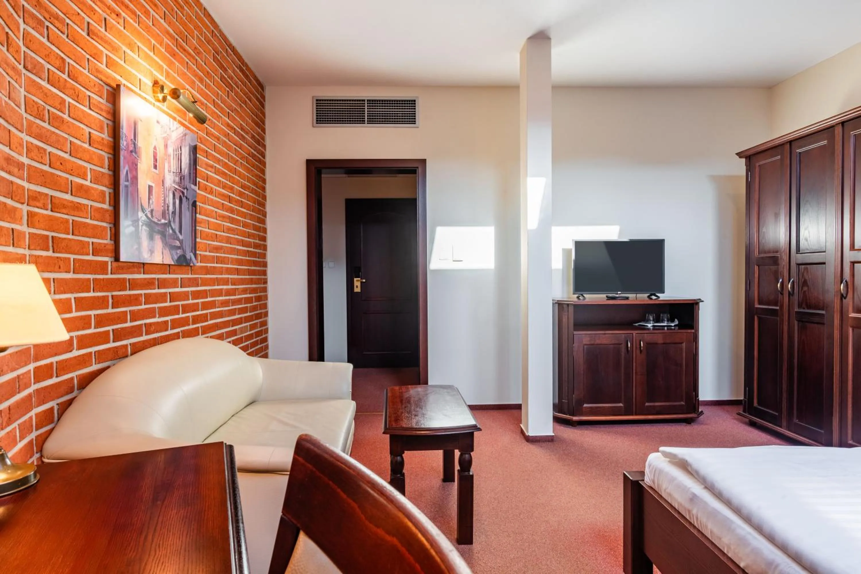 Living room, Bed in Wellness Hotel Gondola