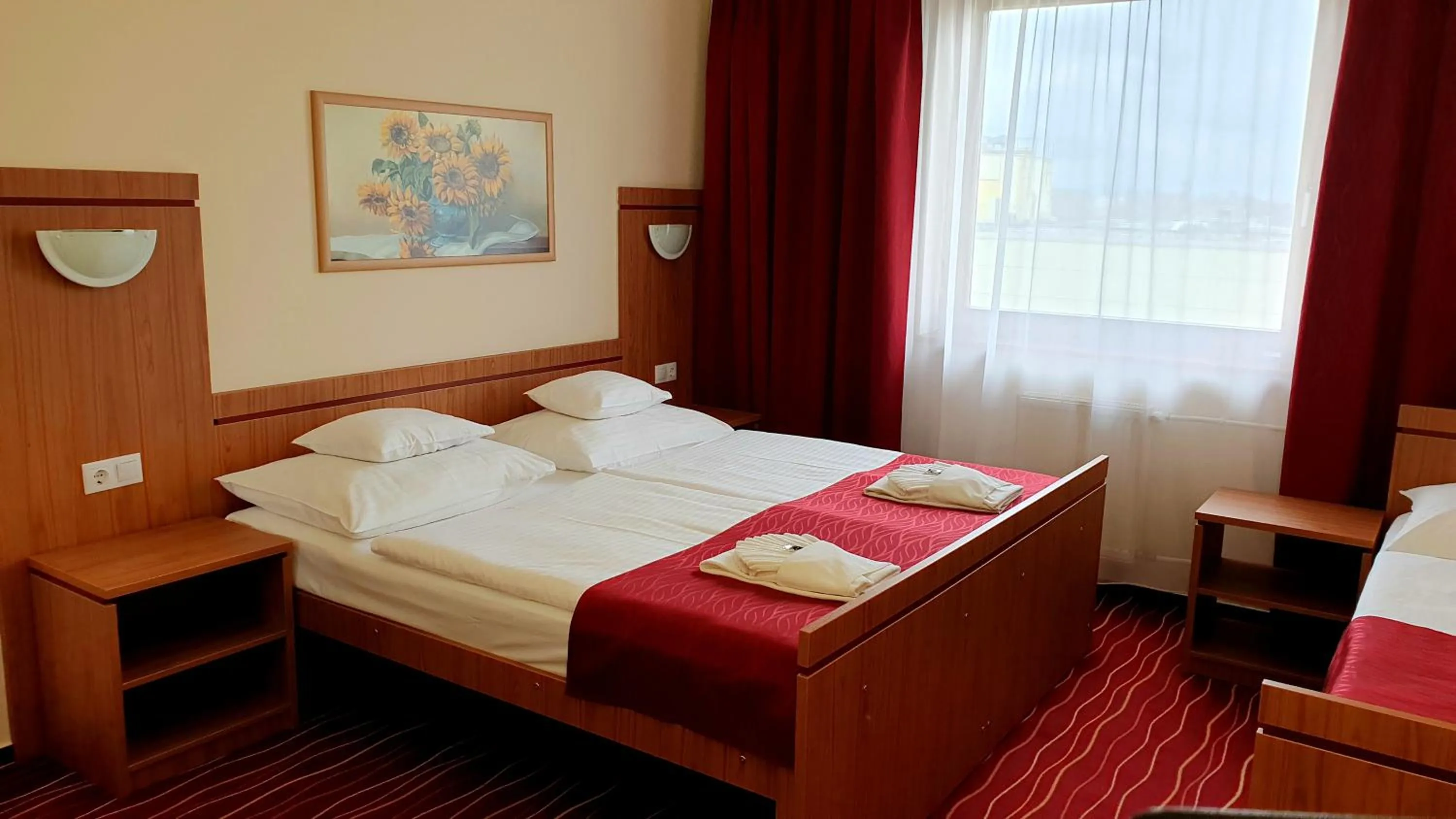 Bed in Diana Club Hotel