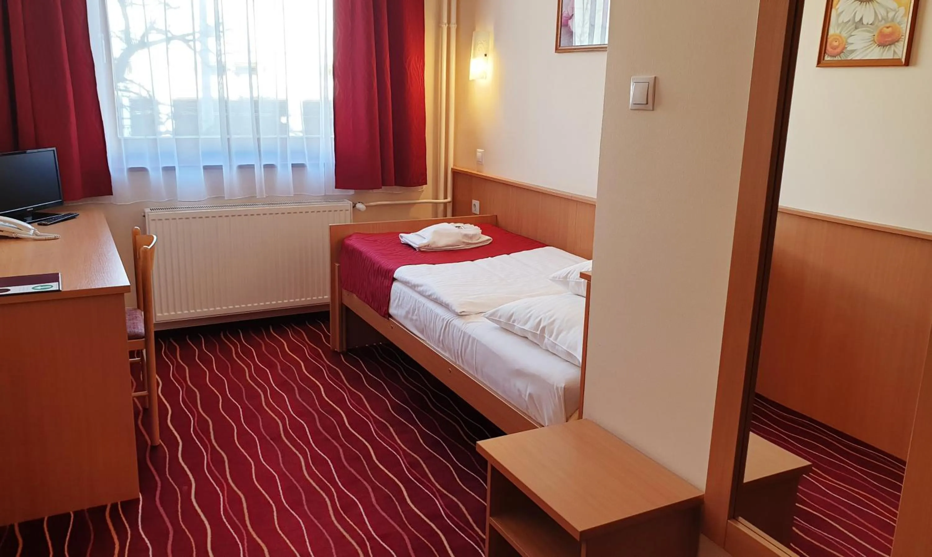 Bed in Diana Club Hotel