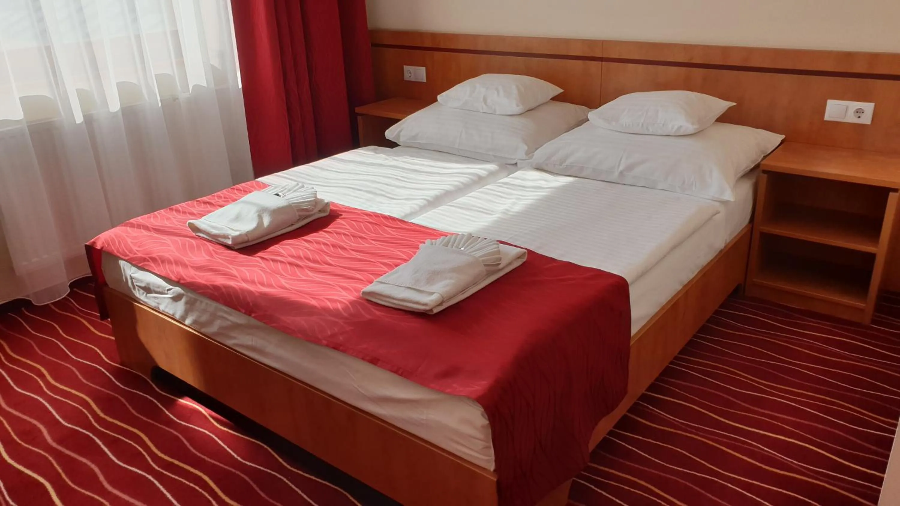 Bed in Diana Club Hotel