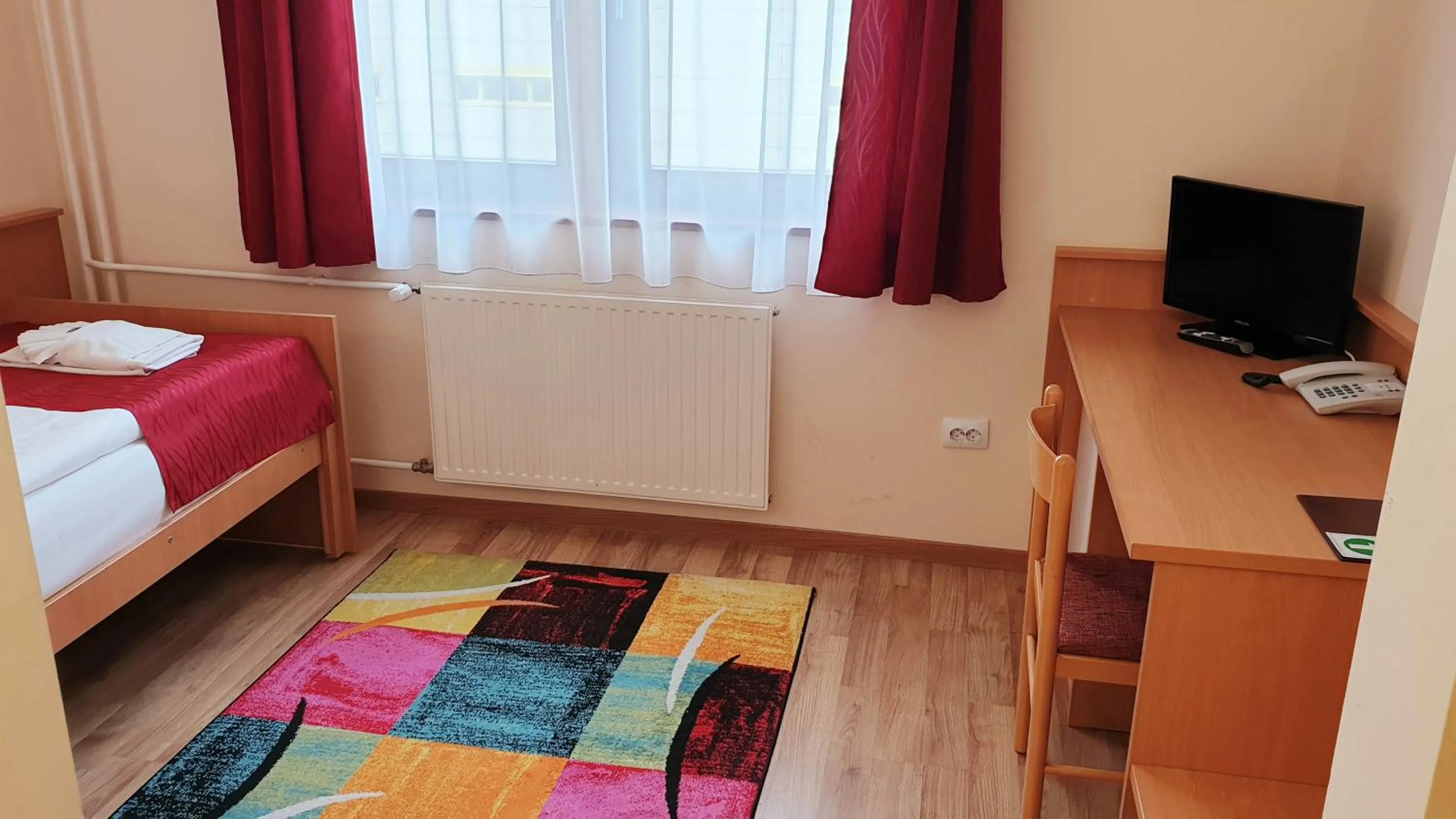 Bed in Diana Club Hotel