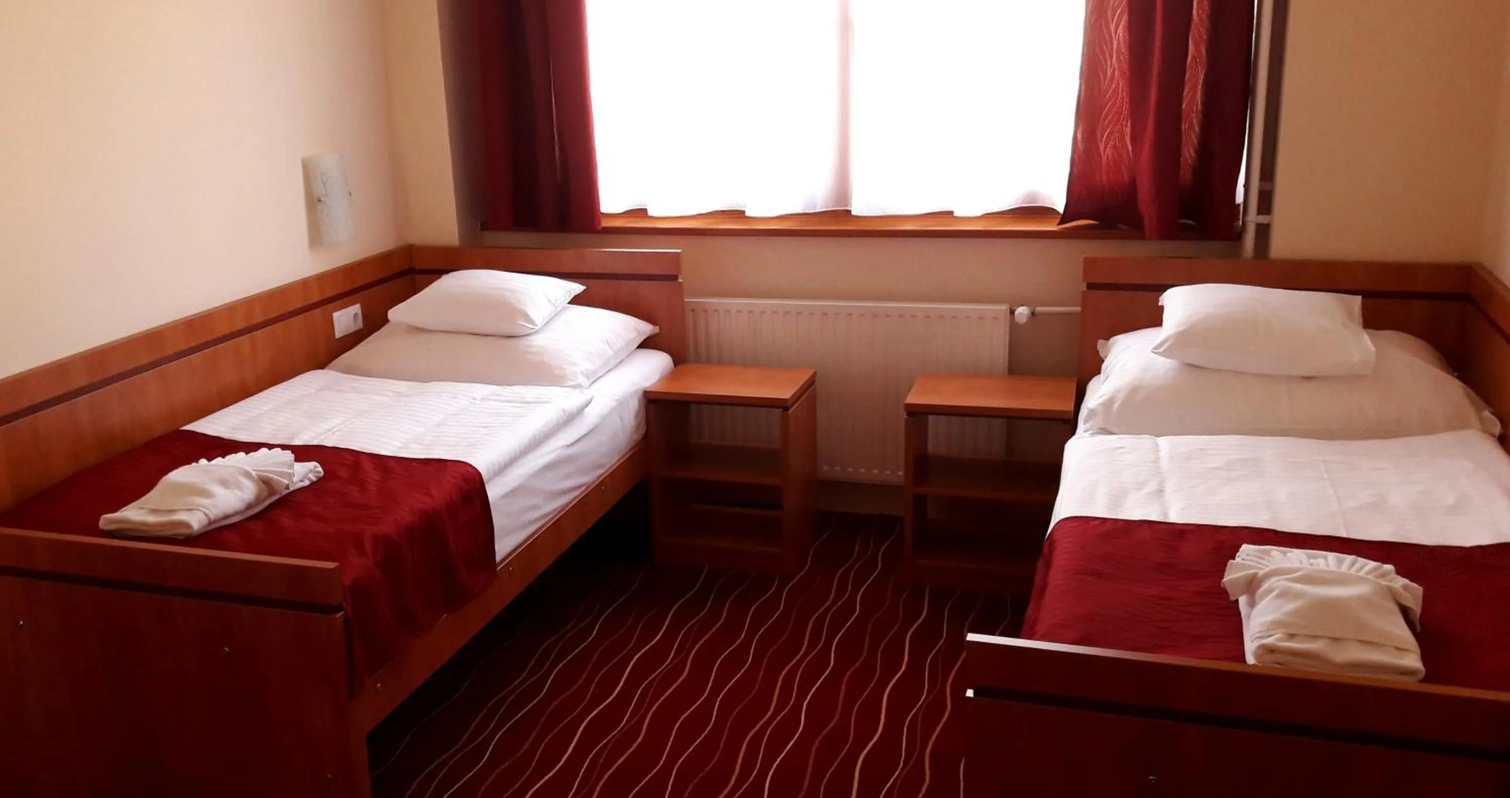 Bed in Diana Club Hotel