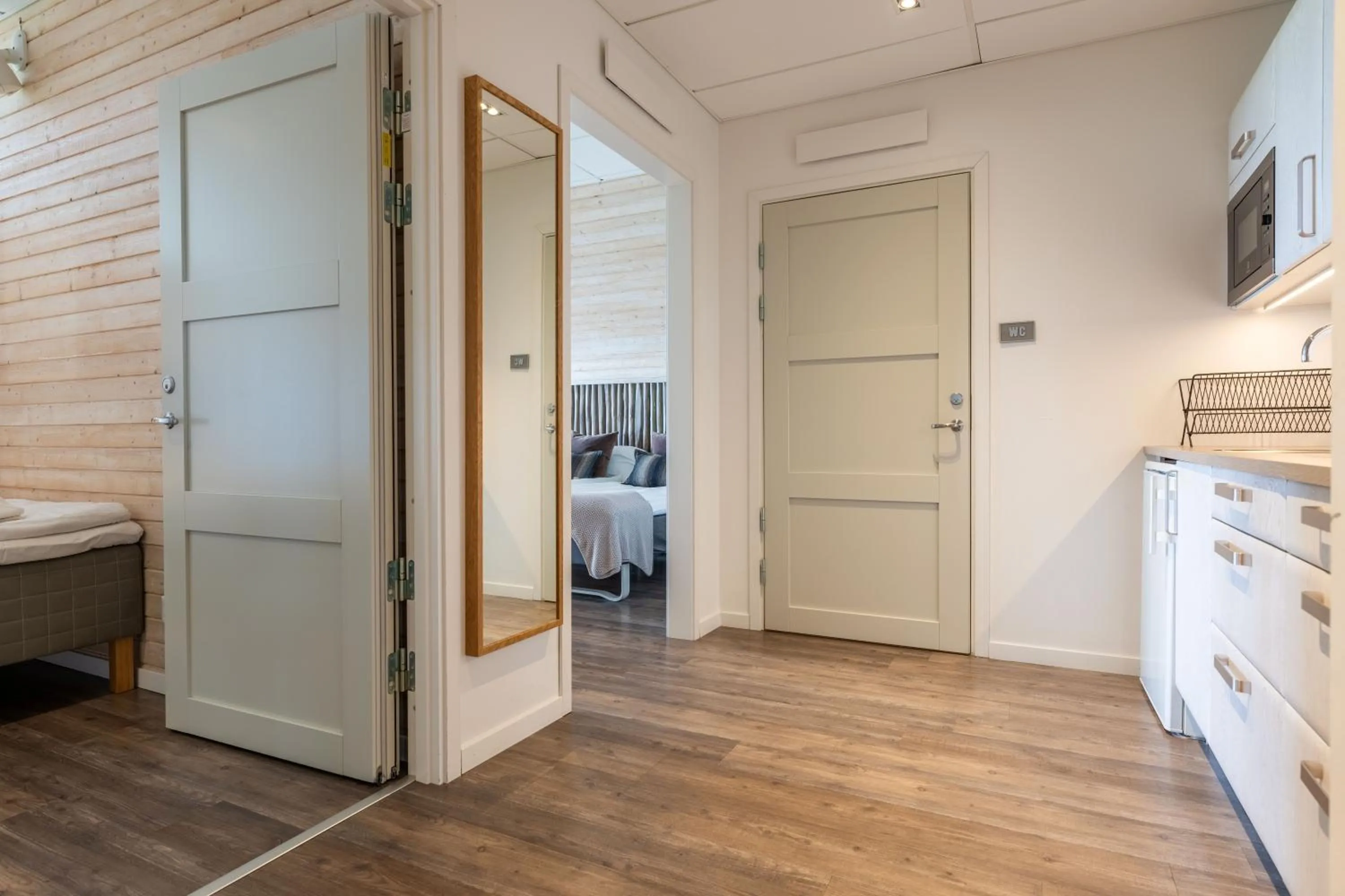 Kitchen or kitchenette, Bed in Halmstad Golfarena Hotell & Lägenheter