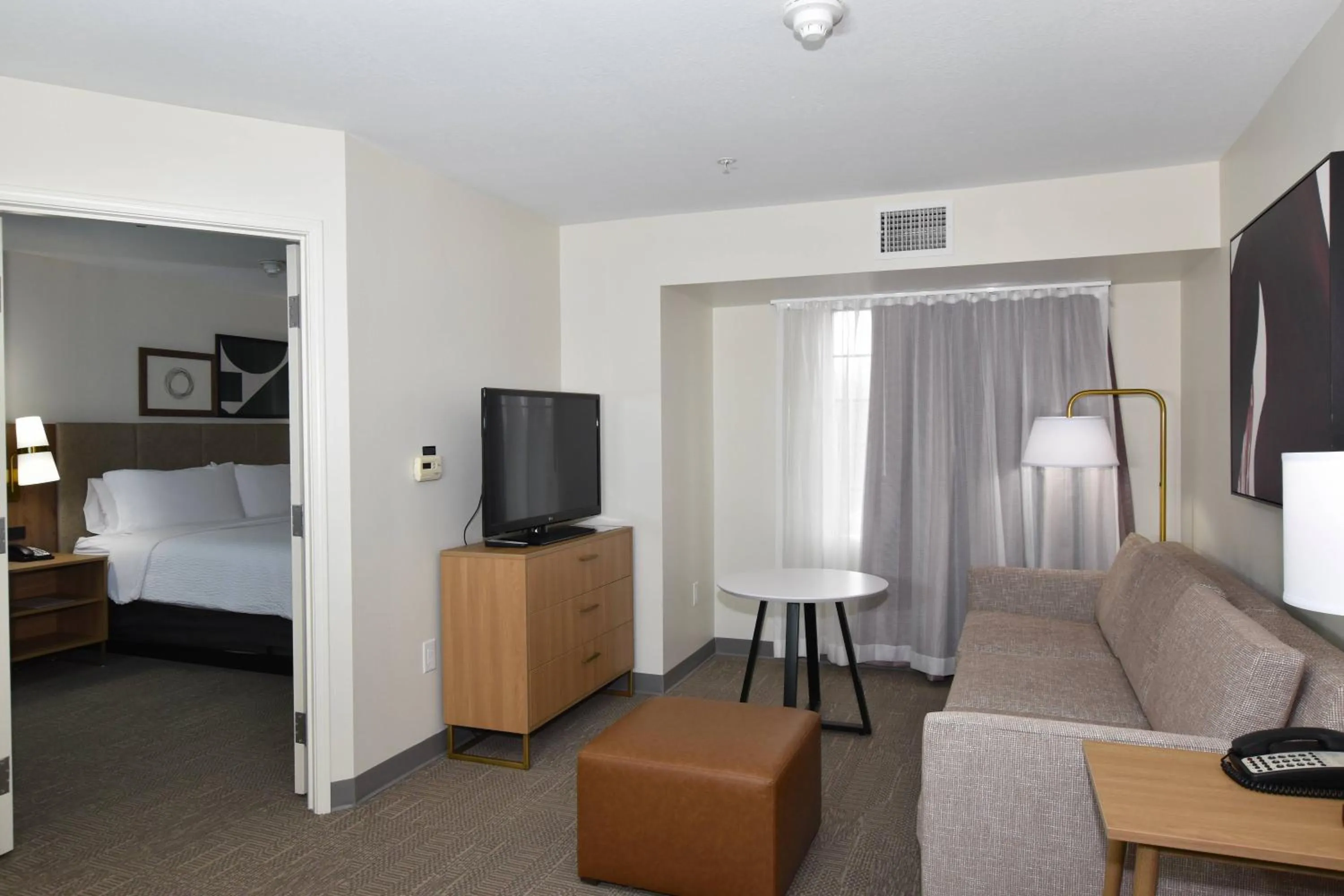 Living room, Bed in Staybridge Suites Detroit-Novi by IHG