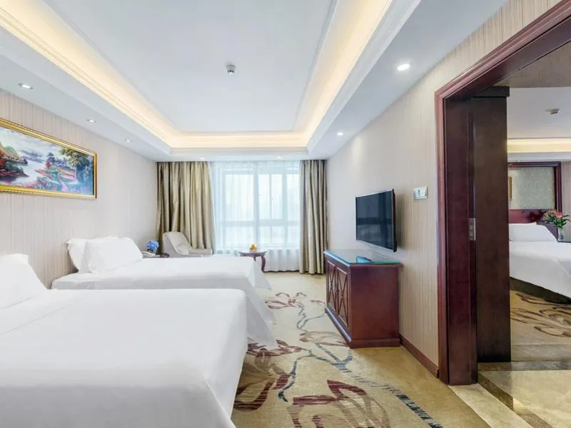 Bed in Vienna Hotel Guilin North High-Speed Railway Station Chengbei