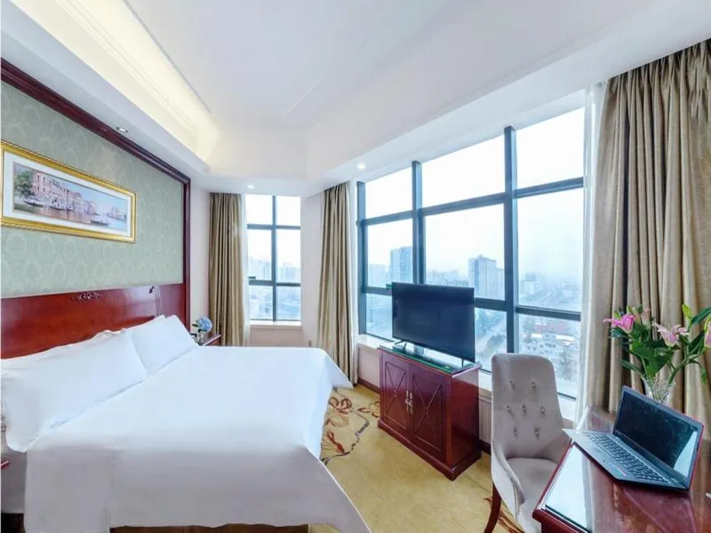 Bed in Vienna Hotel Guilin North High-Speed Railway Station Chengbei