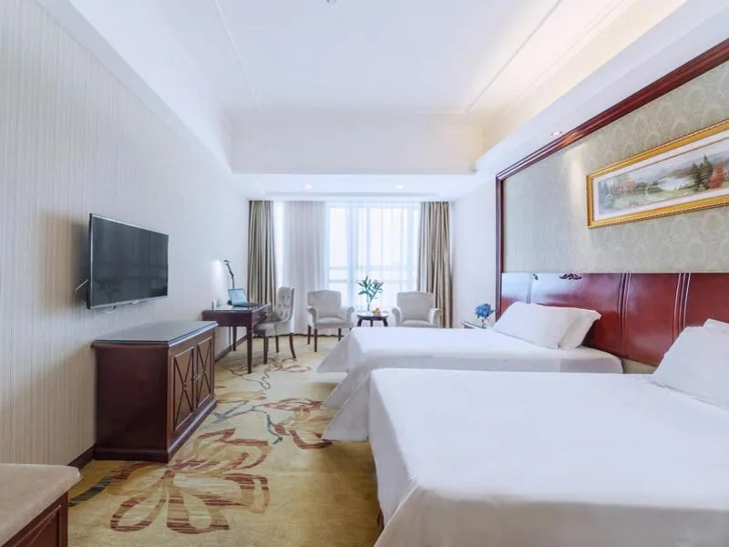 Bed in Vienna Hotel Guilin North High-Speed Railway Station Chengbei