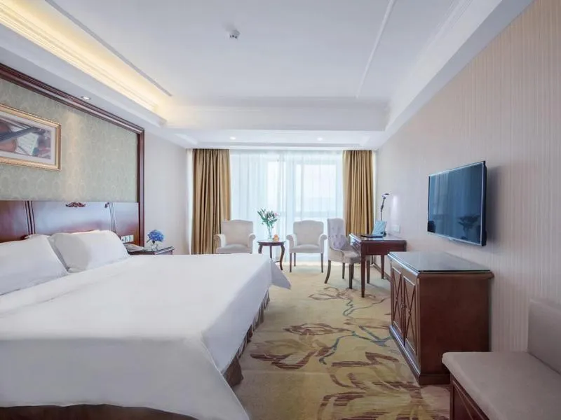 Bed in Vienna Hotel Guilin North High-Speed Railway Station Chengbei