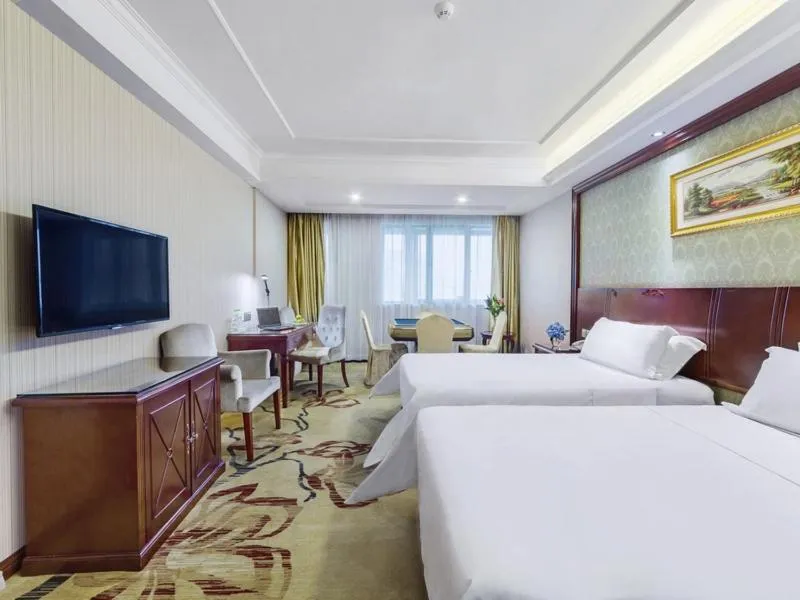 Bed in Vienna Hotel Guilin North High-Speed Railway Station Chengbei